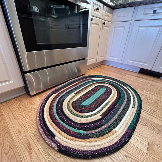 Handmade Washable Cotton Rug for Kitchen Bedroom Or Bedside. Made with premium quilt cotton featuring hues of green, burgundy and beige florals. Washable cotton Jelly Roll Rug.