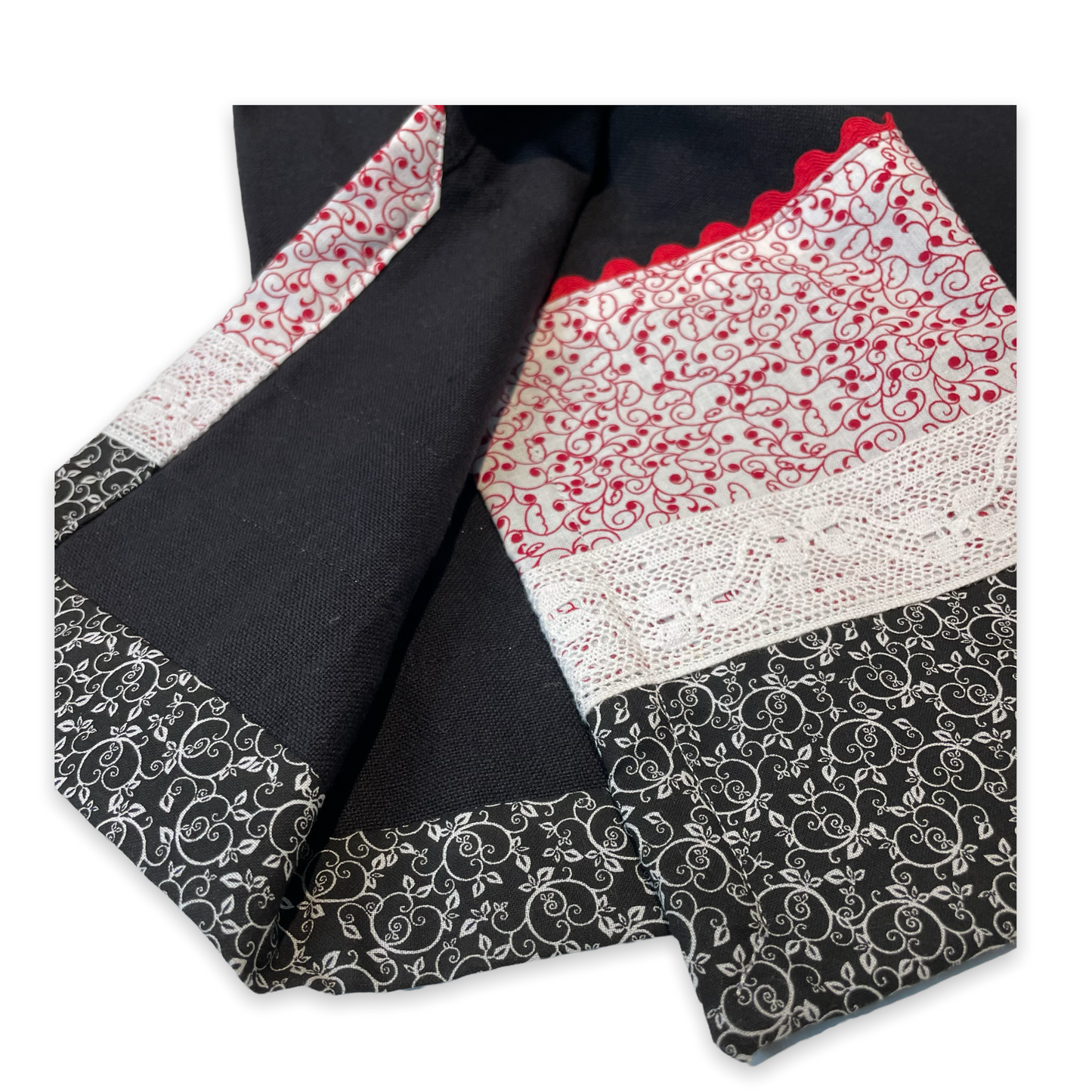 Farmhouse dish towel. Black cotton toweling with quilting cotton accents. Featuring red Ric Rac, wide white polyester lace and button embellishments. Part of a mix and match farmhemian home accents decor line. Browse all the collections online. And be sure to tune into the Home Stitchery Decor YouTube Channel for fabulous fun farmhouse DIY Decor tutorials.