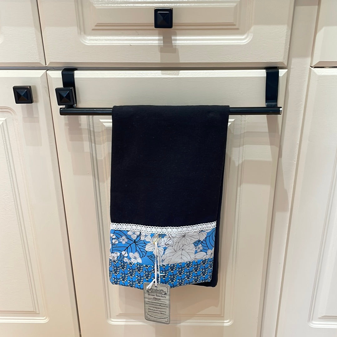 Blue and Black decorative dish towel for your kitchen. Black toweling with blue and white flower cotton accent material. White cotton lace trim. Handcrafted by Home Stitchery Decor. Find your favorite or watch tutorials on the Home Stitchery Decor YouTube Channel and make your own!