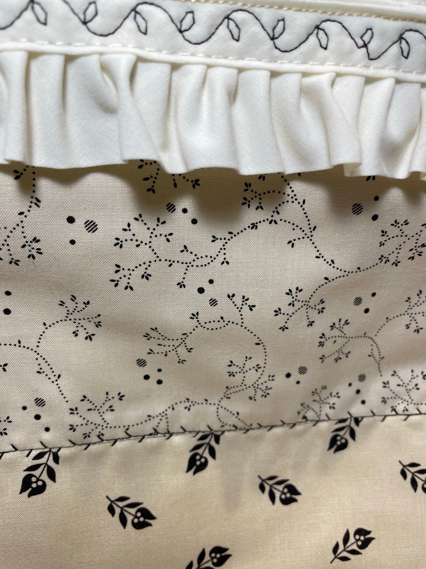 Handcrafted in Canada Farmhouse Style Dish Towel with black flowers on a beige cotton towel and embroidery details. Purchase this product or learn to make your own on the Home Stitchery Decor YouTube Channel. Part of a coordinating product line.