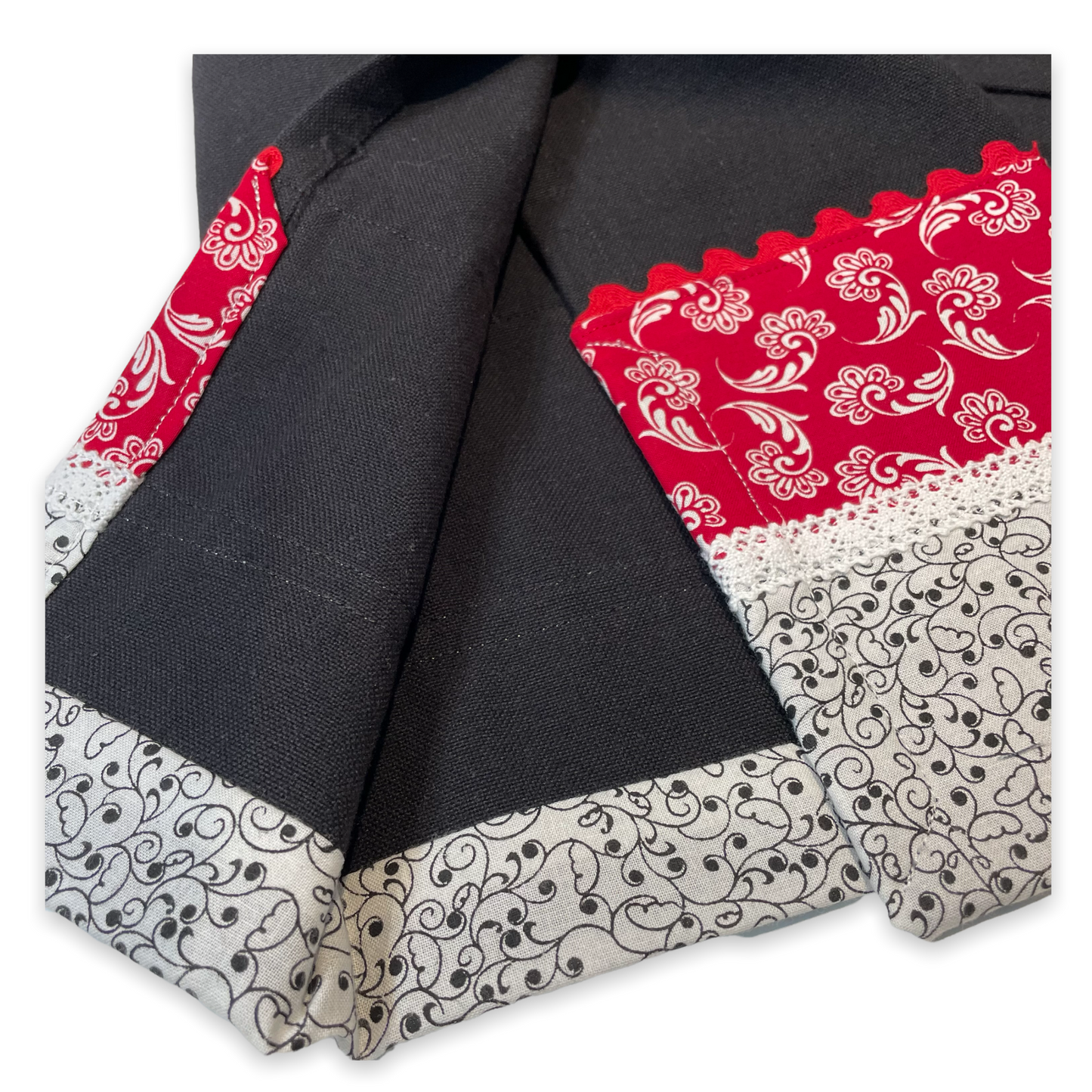 Farmhouse dish towel. Black cotton toweling with quilting cotton accents. Featuring red Ric Rac, white polyester lace and button embellishments. Part of a mix and match farmhemian home accents decor line. Browse all the collections online. And be sure to tune into the Home Stitchery Decor YouTube Channel for fabulous fun farmhouse DIY Decor tutorials.