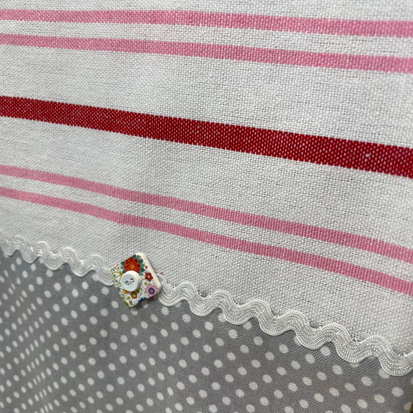 Cute red, white and pink towel with handcrafted quilting cotton accents. Featuring red Ric Rac, white Ric Rac and and heart shaped button. Part of a mix and match collection of coordinated kitchen and bath decor. Browse your favorites and be sure to follow along on the Home Stitchery Decor YouTube Channel