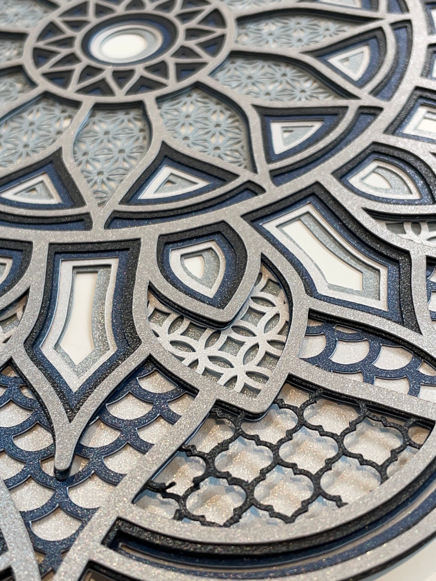 close up image of 3d layered Mandala design by Home Stitchery Decor. 3d Layered Mandala svg files for sale, instant download with complete tutorial and supply list for your Cricut crafting success.