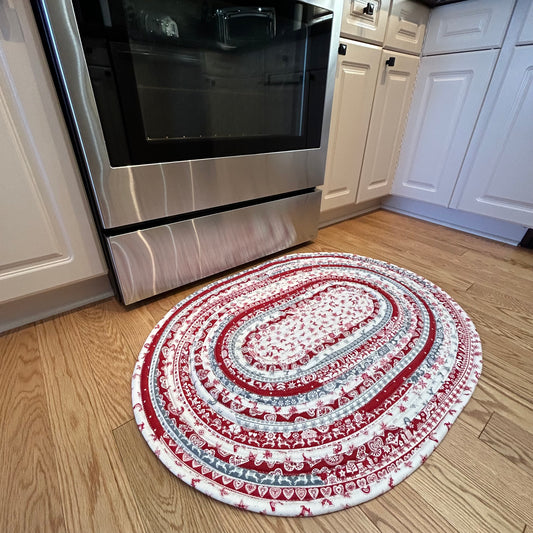 Handmade Christmas Kitchen Rug. Washable Cotton Jelly Roll Rug for Kitchen, Bedside or Bathmat. Featuring premium quilt cotton with red, white and grey Christmas prints. Made in Canada