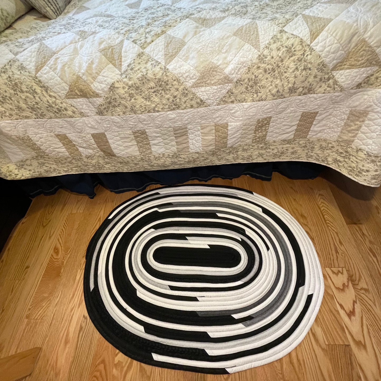Handmade Kitchen Jelly Roll Rug. Featuring black, grey and white tones of quilting cotton. Washable and durable this rug will last for years. Handmade in Canada by Home Stitchery Decor