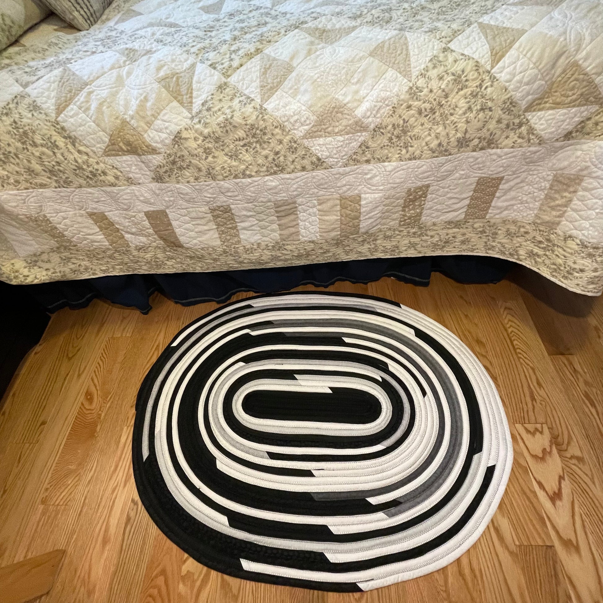 Handmade Kitchen Jelly Roll Rug. Featuring black, grey and white tones of quilting cotton. Washable and durable this rug will last for years. Handmade in Canada by Home Stitchery Decor