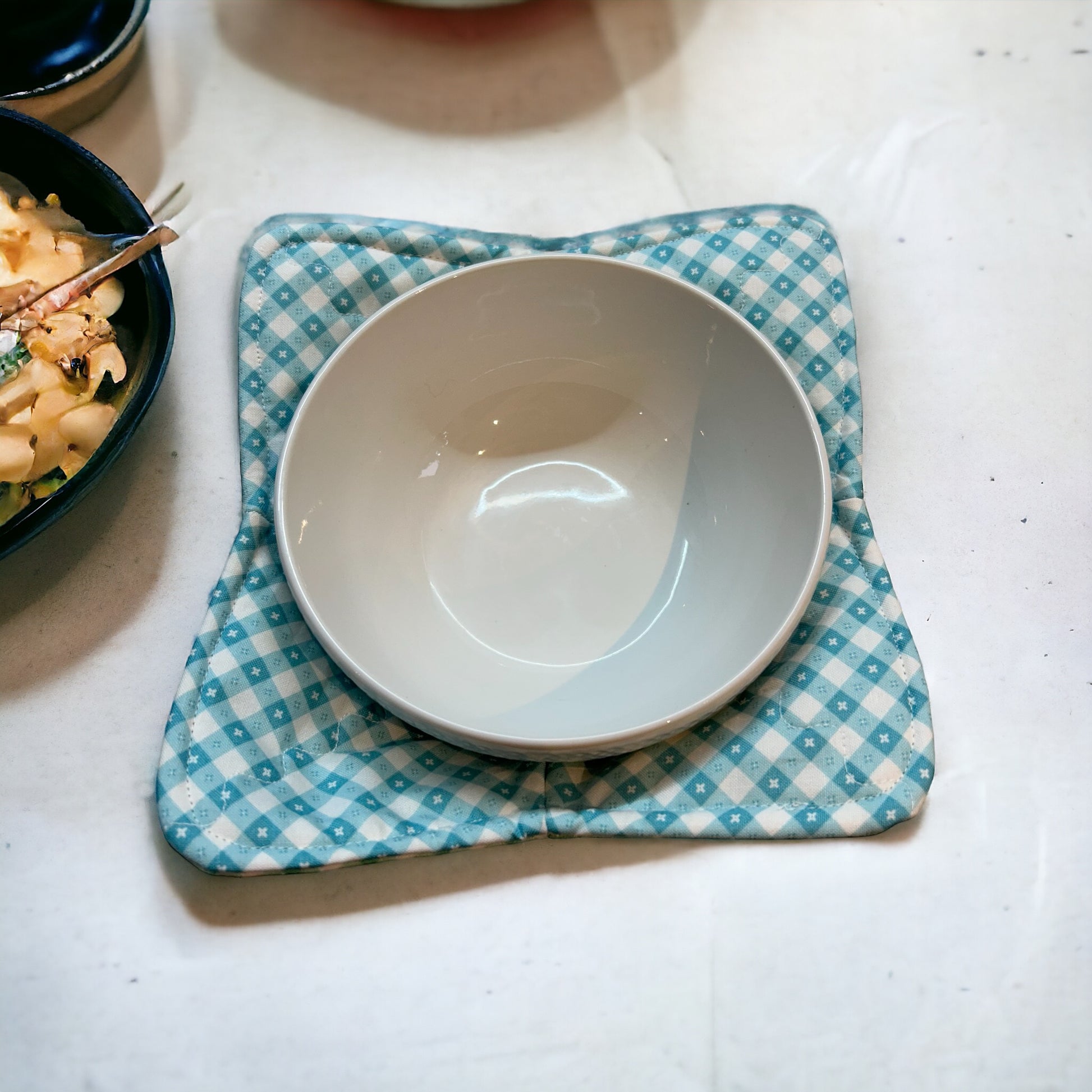 Checkered Kitchen Soup Bowl Cozy for Hot Soup Bowl. Reversible and washable this cute cozy is made with green and blue checkered quilt cotton and Pellon Wrap and Zap Batting.