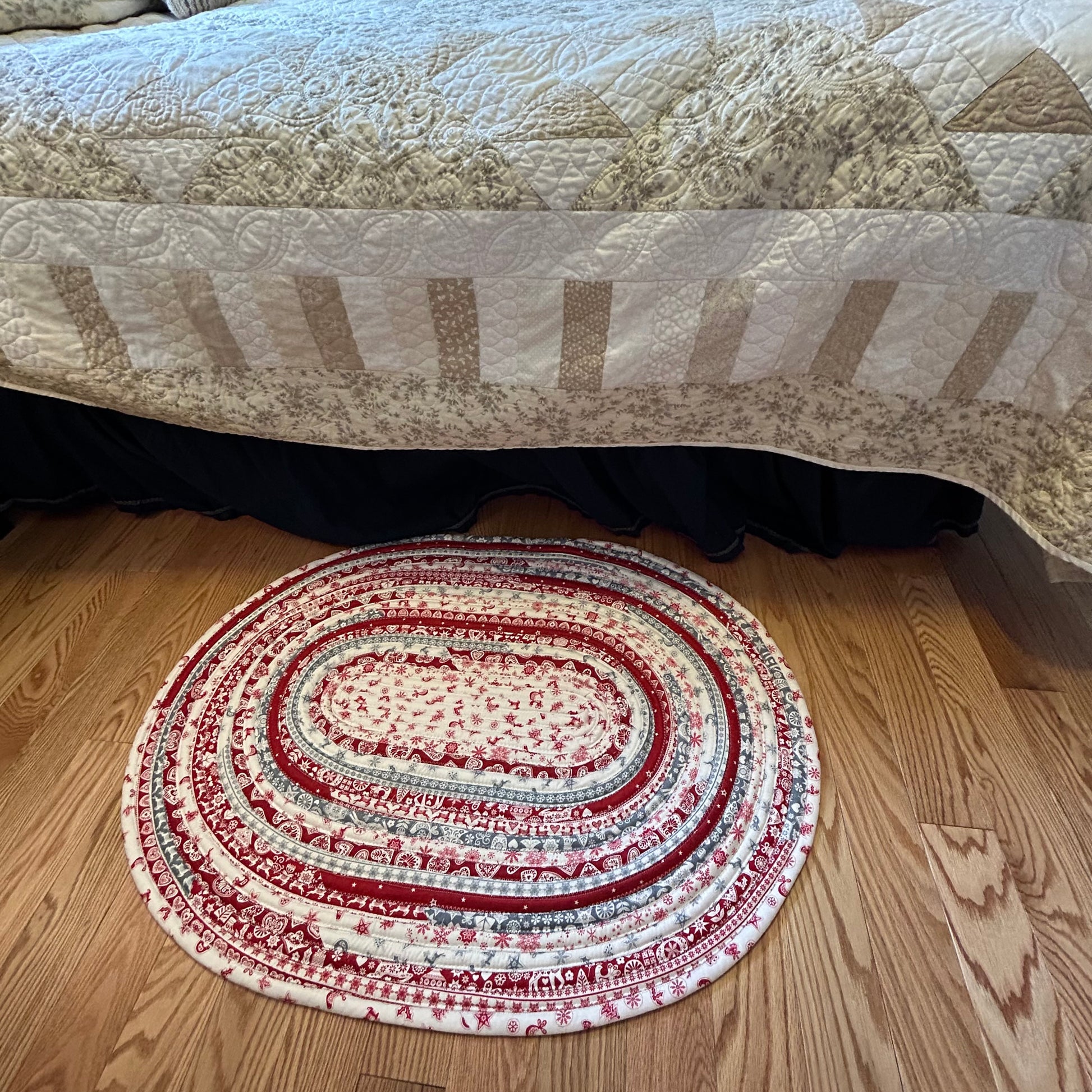 Handmade Christmas Kitchen Rug. Washable Cotton Jelly Roll Rug for Kitchen, Bedside or Bathmat. Featuring premium quilt cotton with red, white and grey Christmas prints. Made in Canada