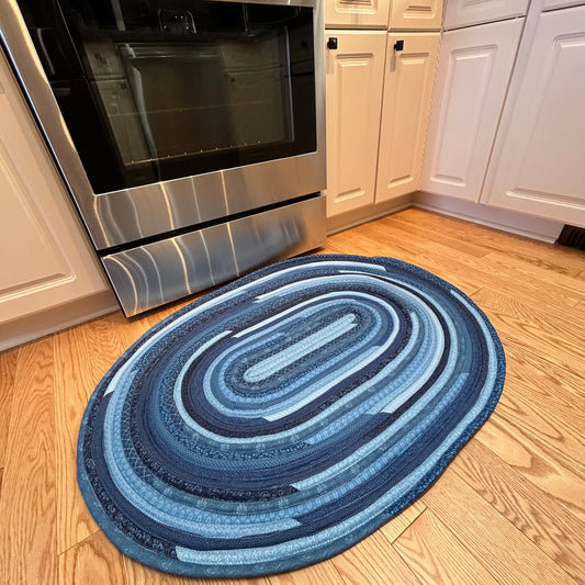 Blue Handmade Jelly Roll Rug for Kitchen. Or use as a bedside rug or luxury bathmat. It's cozy, washable, reversible and made to last. At Home Stitchery Decor we aim to bring beauty and function to home decor just like grandma used to make!
