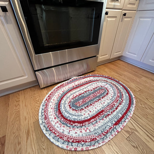 Scandinavian Christmas Print Handmade Cotton Jelly Roll Rug for Kitchen, Luxury Bathmat or Bedside Rug.  Washable and reversible, this is a cozy cotton rug that will wash and wear for years to come.  Made in Canada by Home Stitchery Decor