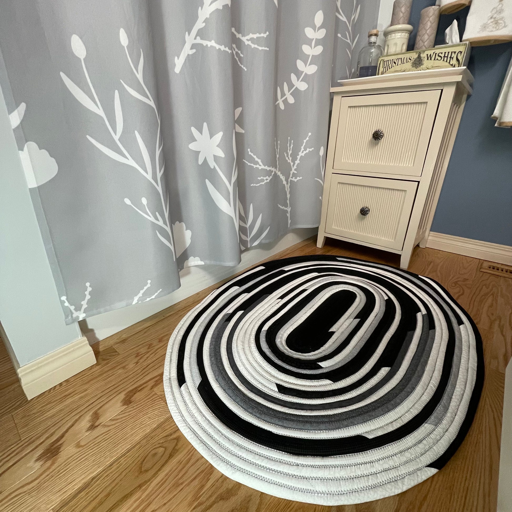 Handmade Kitchen Jelly Roll Rug. Featuring black, grey and white tones of quilting cotton. Washable and durable this rug will last for years. Handmade in Canada by Home Stitchery Decor