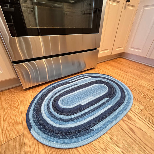 Blue Cotton Kitchen Rug. Handmade with premium quilting cotton this rug is called a Jelly Roll Rug or Rag Rug. Handmade in Canada, it's washable and durable!
