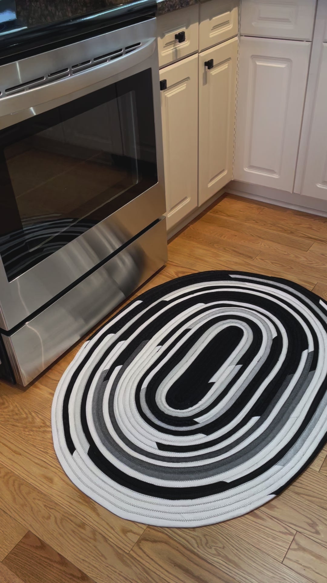 Handmade Kitchen Jelly Roll Rug. Featuring black, grey and white tones of quilting cotton. Washable and durable this rug will last for years. Handmade in Canada by Home Stitchery Decor