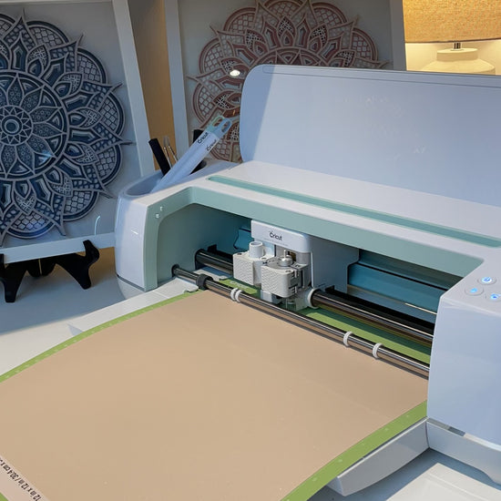 Time lapse video of cutting out a 3d Layered Mandala.  In the background are two framed Mandalas by Home Stitchery Decor.  SVG layered mandala designs for sale by Home Stitchery Decor.  Follow along with the complete 3D layered Mandala tutorail on the Home Stitchery Decor YouTube Channel