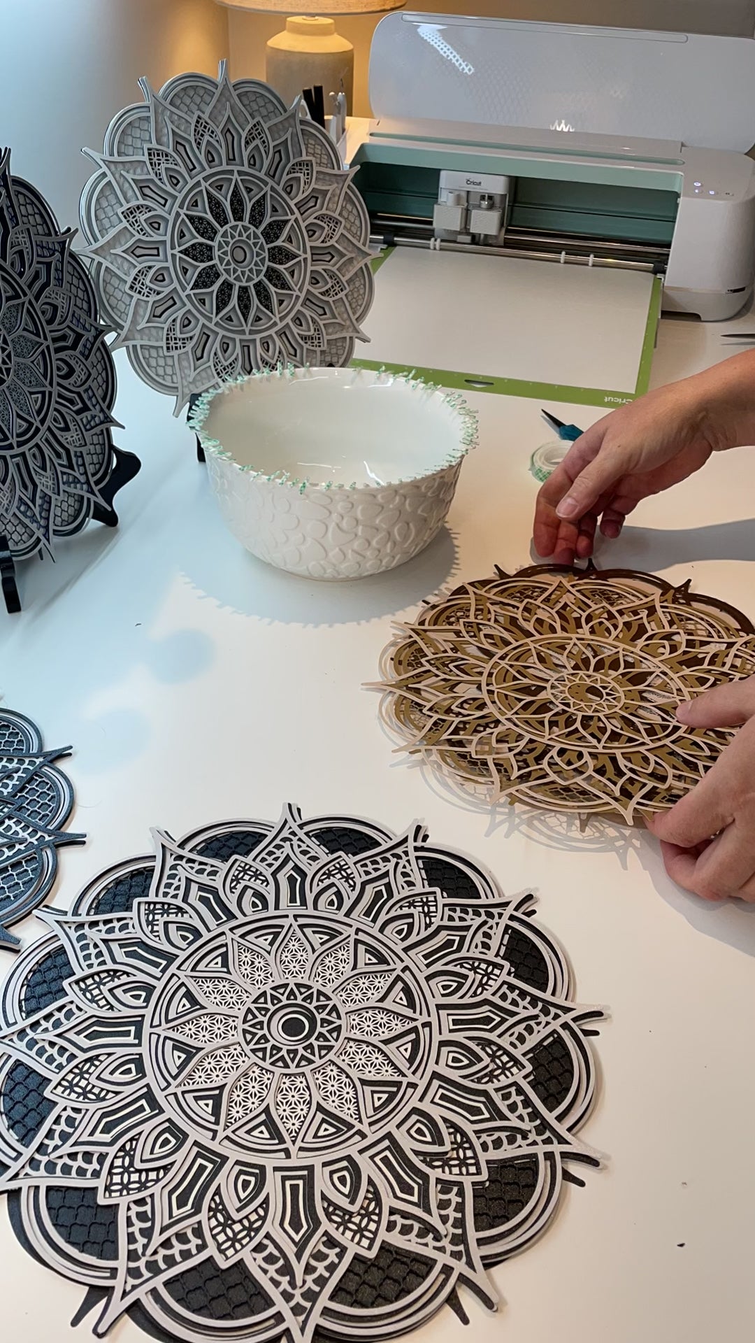 Close up high speed video of creating a 3d layered Mandala.  Design is exclusive to Home Stitchery Decor and the instant download SVG file comes with a complete tutorial and supply lists for your crafting success.  I made this one with a Cricut but the files can be sized and used with larger laser machines. Check out all our 3d Layered Mandala Designs at Home Stitchery Decor