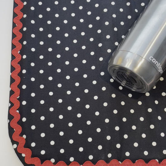 Retro Black and White Polka Dot Dish Drying Mat with Red and white trim and a black accent button. Vintage style kitchen decor for 21st century. Part of a mix and match collection so be sure to check out all the coordinating products. Handcrafted in Canada. Find out more on the Home Stitchery Decor YouTube Channel