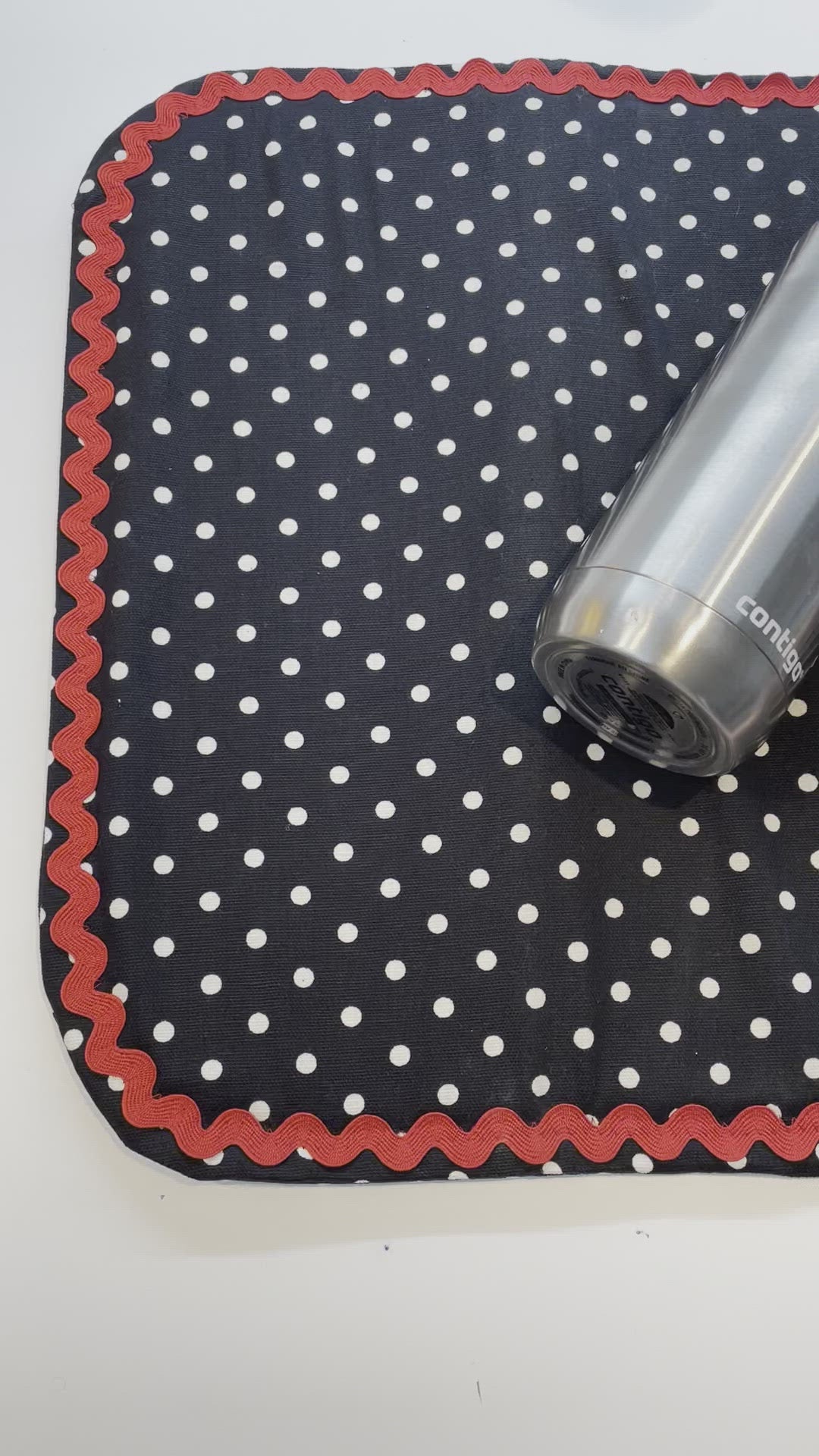Retro Black and White Polka Dot Dish Drying Mat with Red and white trim and a black accent button. Vintage style kitchen decor for 21st century. Part of a mix and match collection so be sure to check out all the coordinating products. Handcrafted in Canada. Find out more on the Home Stitchery Decor YouTube Channel