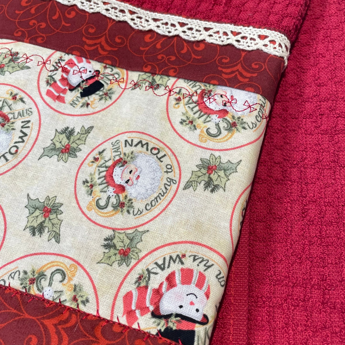 Retro Santas and Snowmen adorn this red Christmas Tea Towel. Handcrafted in Canada. Part of a mix and match collection of home decor. Shop the look at Home Stitchery Decor.
