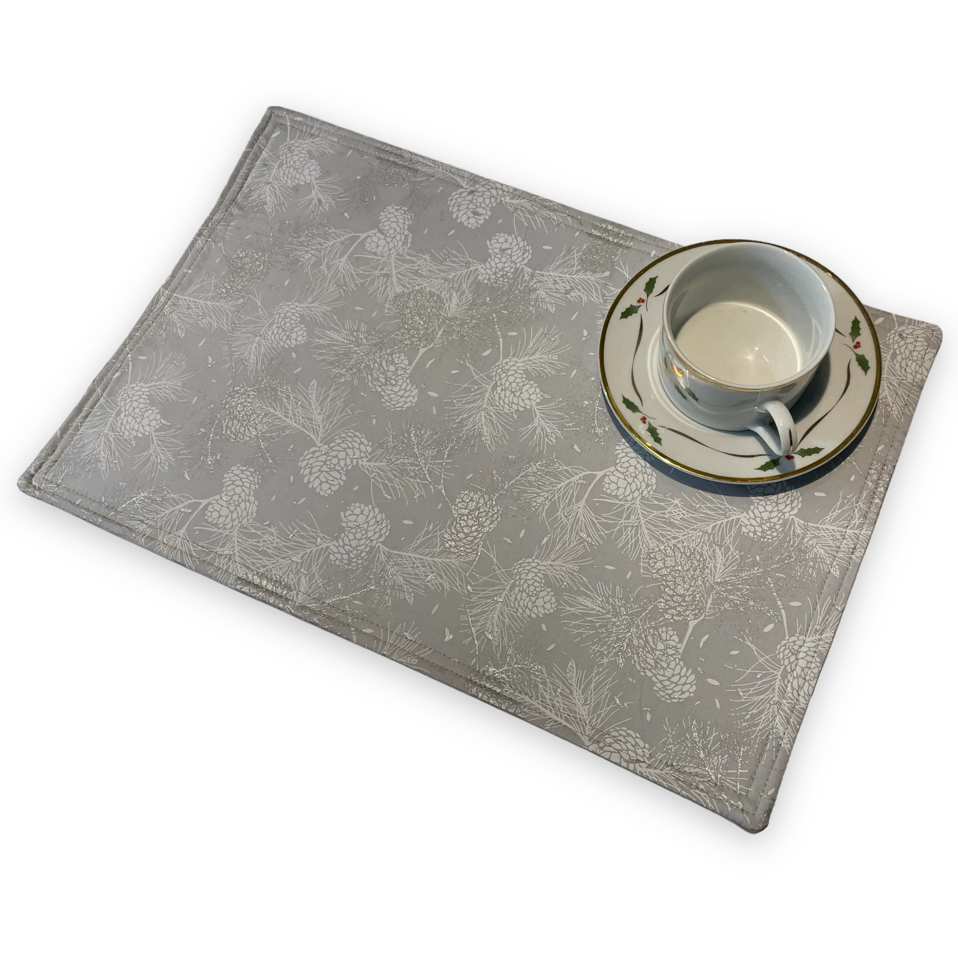 Reversible Christmas Placemats Featuring Gold and Silver Ornaments on one side and Silver Pinecones on the opposite side. Luxurious handmade Christmas Table Placemats. Part of a collection by Home Stitchery Decor. Check out all the mix and match items online.
