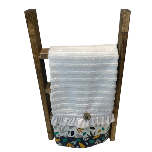 White textured kitchen towel with plants, frilled trim and button details. Displayed on a wooden tea towel kitchen counter ladder. Mix and match your favorite coordinating items. Or follow along with sewing tutorials on the Home Stitchery Decor YouTube Channel.