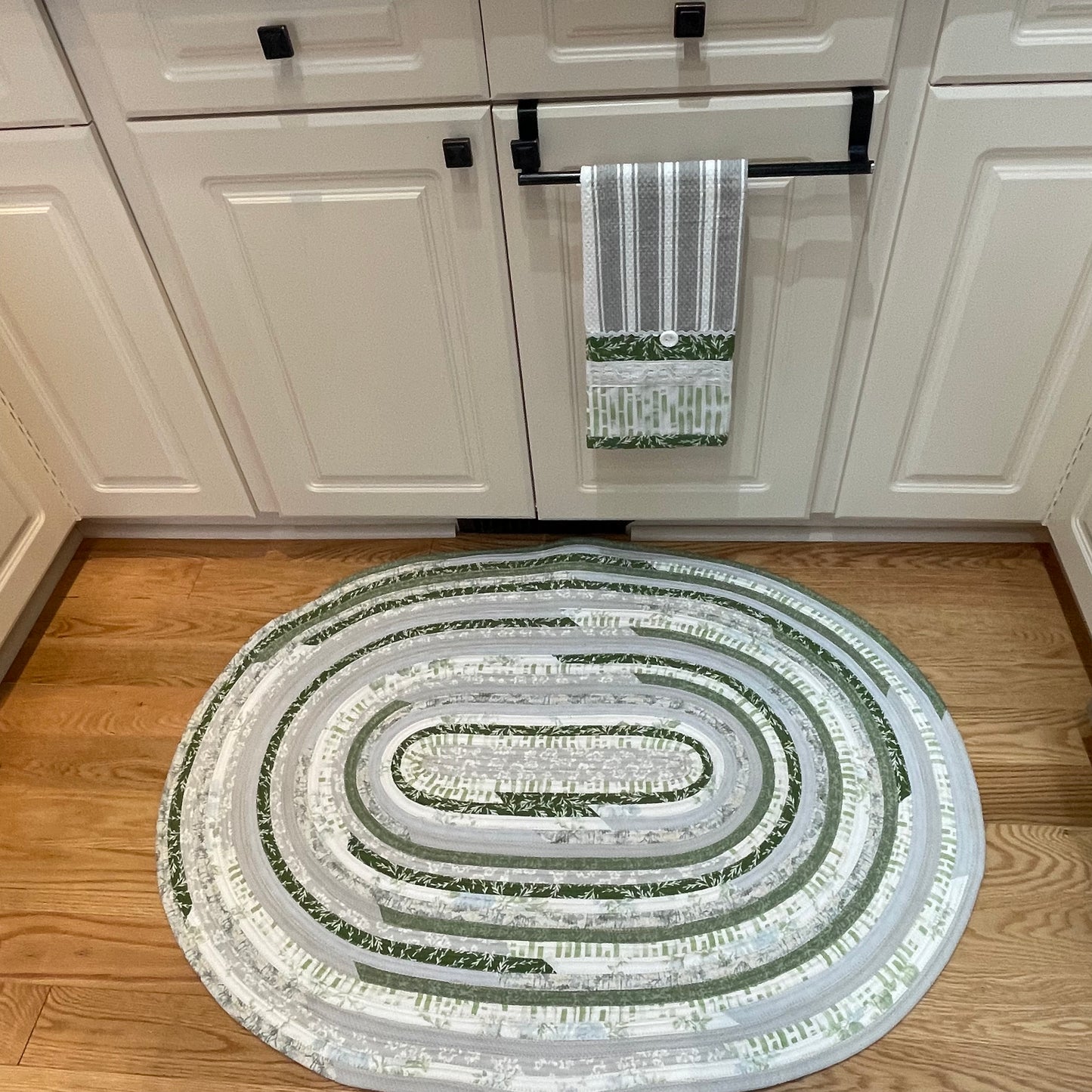 Green and grey cotton kitchen, bedside or bathmat accent rug.  Washable and handcrafted exclusively by Home Stitchery Decor.  Part of a mix and match collection. Features high quality quilting cotton exterior and Pellon Batting fill.  One of a kind.
