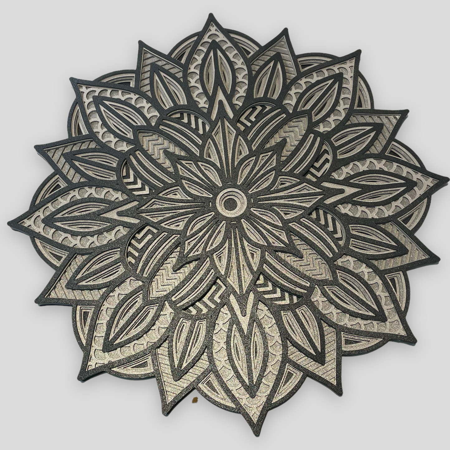 Close up view of a 3d layered Mandala SVG Design by Home Stitchery Decor. We cut this out with our Cricut Maker and you can too! Just follow along with our complete 3d Layered Mandala tutorial. Find your favorite 3d layered Mandala designs by Home Stitchery Decor