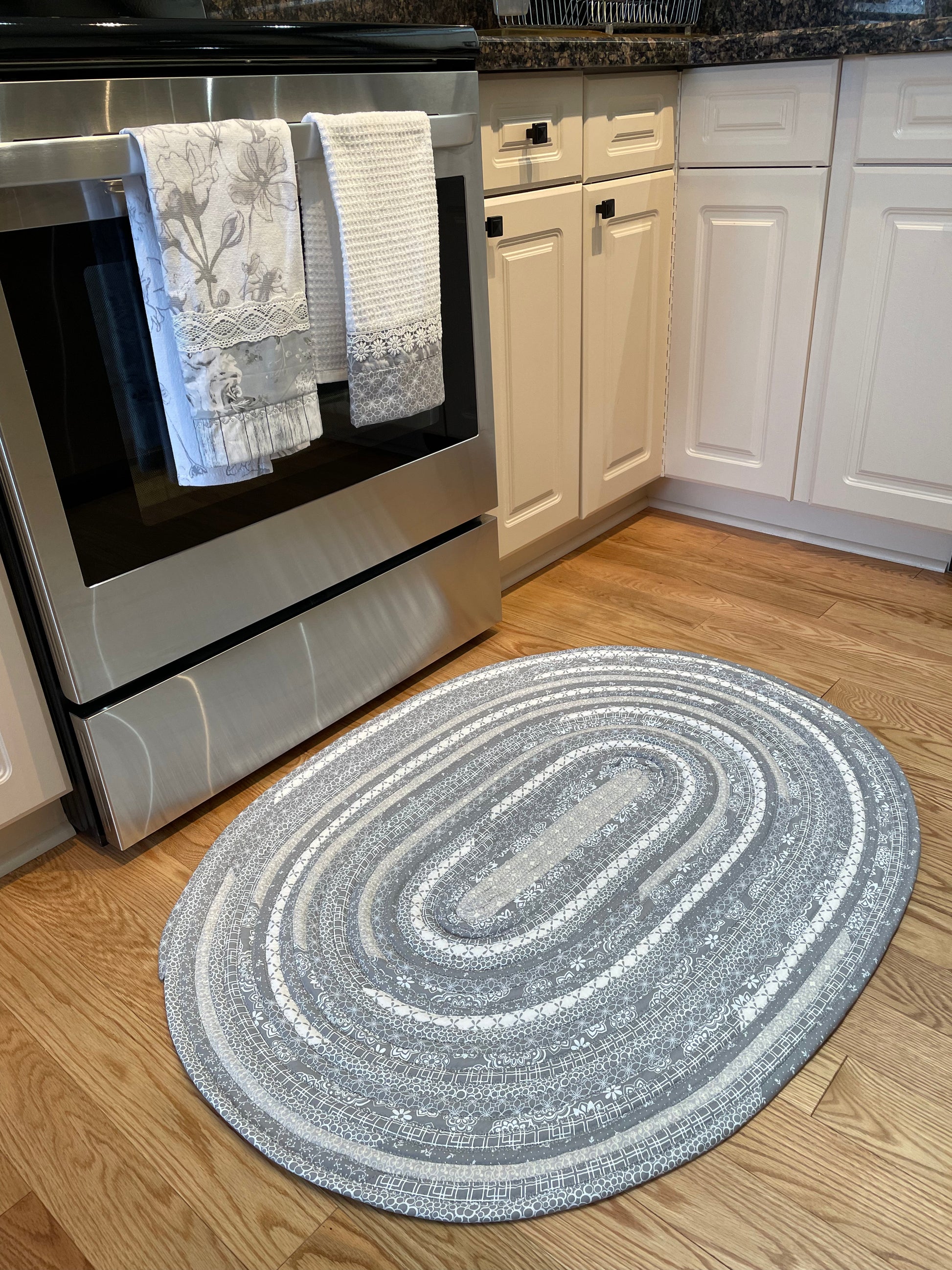 Grey and White Modern Farmhouse Kitchen Accent Rug. Can be used as a luxury bathmat, or bedside rug. Washable, Cotton and made in Canada with globally sourced supplies. Matching dish towels and shower curtains also available. Check out the Home Stitchery Decor YouTube Channel.