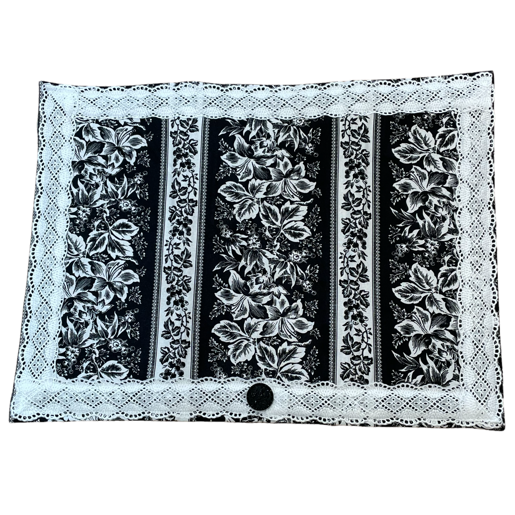 Black and white flowered kitchen dish drying mat. With white lace and button accent. Dress up your kitchen with coordinated kitchen linens by Home Stitchery Decor. Shop the mix and match kitchen decor online or follow me to a Farmers Market. Details on website. Or follow along with sewing and Mandala Art tutorials on the Home Stitchery Decor YouTube Channel.