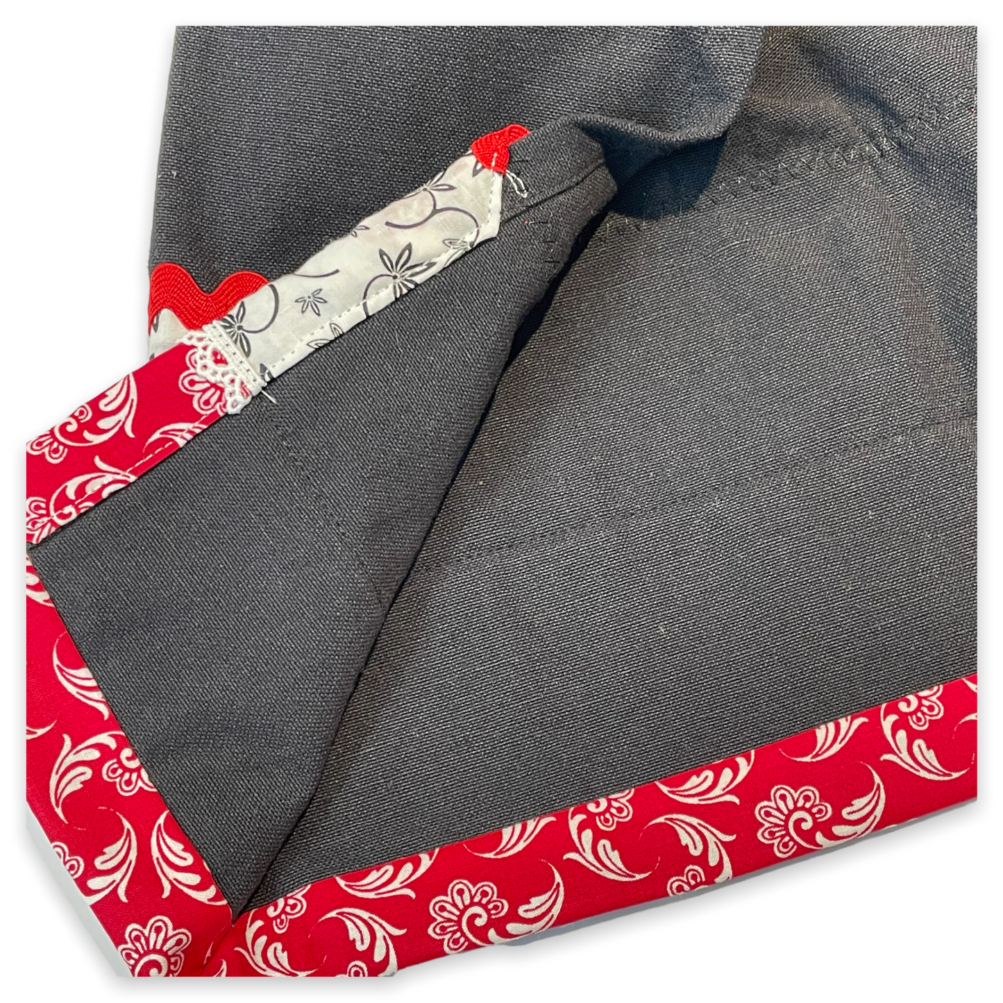Farmhouse dish towel. Black cotton toweling with quilting cotton accents. Featuring red Ric Rac, white delicatepolyester lace and button embellishments. Part of a mix and match farmhemian home accents decor line. Browse all the collections online. And be sure to tune into the Home Stitchery Decor YouTube Channel for fabulous fun farmhouse DIY Decor tutorials.