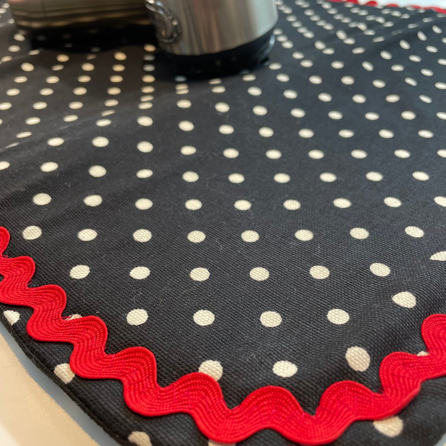 Retro Black and White Polka Dot Dish Drying Mat with Red and white trim and a black accent button. Vintage style kitchen decor for 21st century. Part of a mix and match collection so be sure to check out all the coordinating products. Handcrafted in Canada. Find out more on the Home Stitchery Decor YouTube Channel
