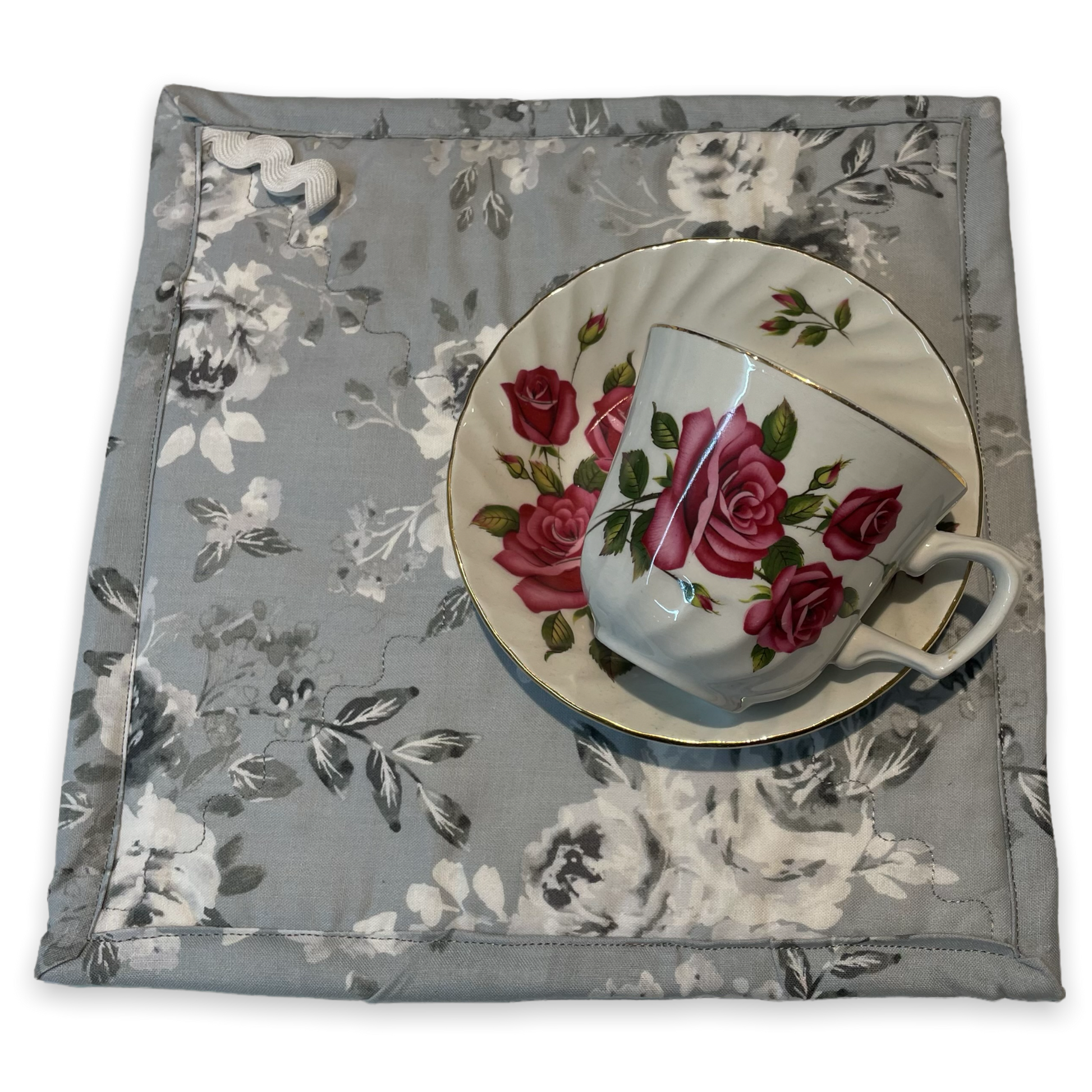 Grey and White farmhouse styled kitchen pot holder.  Part of a collection of mix and match modern farmhouse style home decor. Shop your favorites and follow along on the Home Stithcery Decor YouTube Channel. Tea cup set is a prop. 