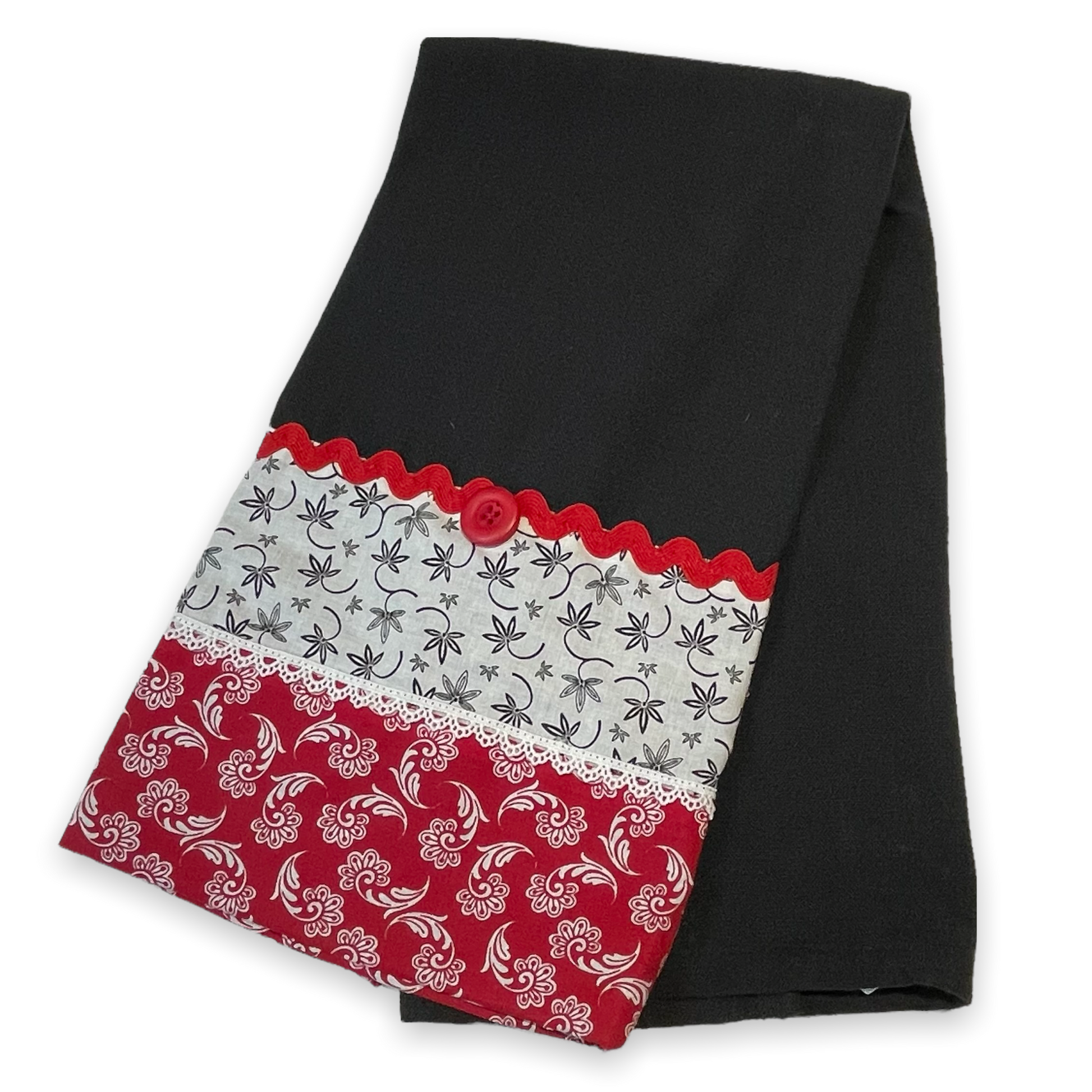 Farmhouse dish towel. Black cotton toweling with quilting cotton accents. Featuring red Ric Rac, white delicatepolyester lace and button embellishments. Part of a mix and match farmhemian home accents decor line. Browse all the collections online. And be sure to tune into the Home Stitchery Decor YouTube Channel for fabulous fun farmhouse DIY Decor tutorials.