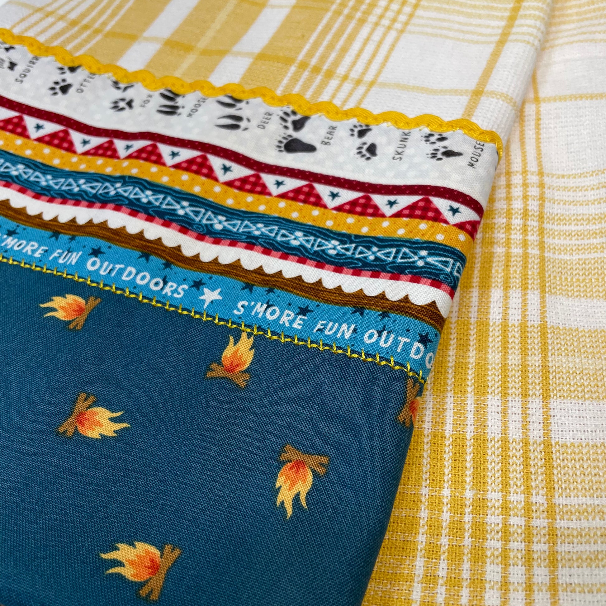 Yellow and Teal Glamping Tea Towel. Cute camping themed mix and match decor. Shop the entire collection and follow along on the Home Stitchery Decor YouTube Channel.