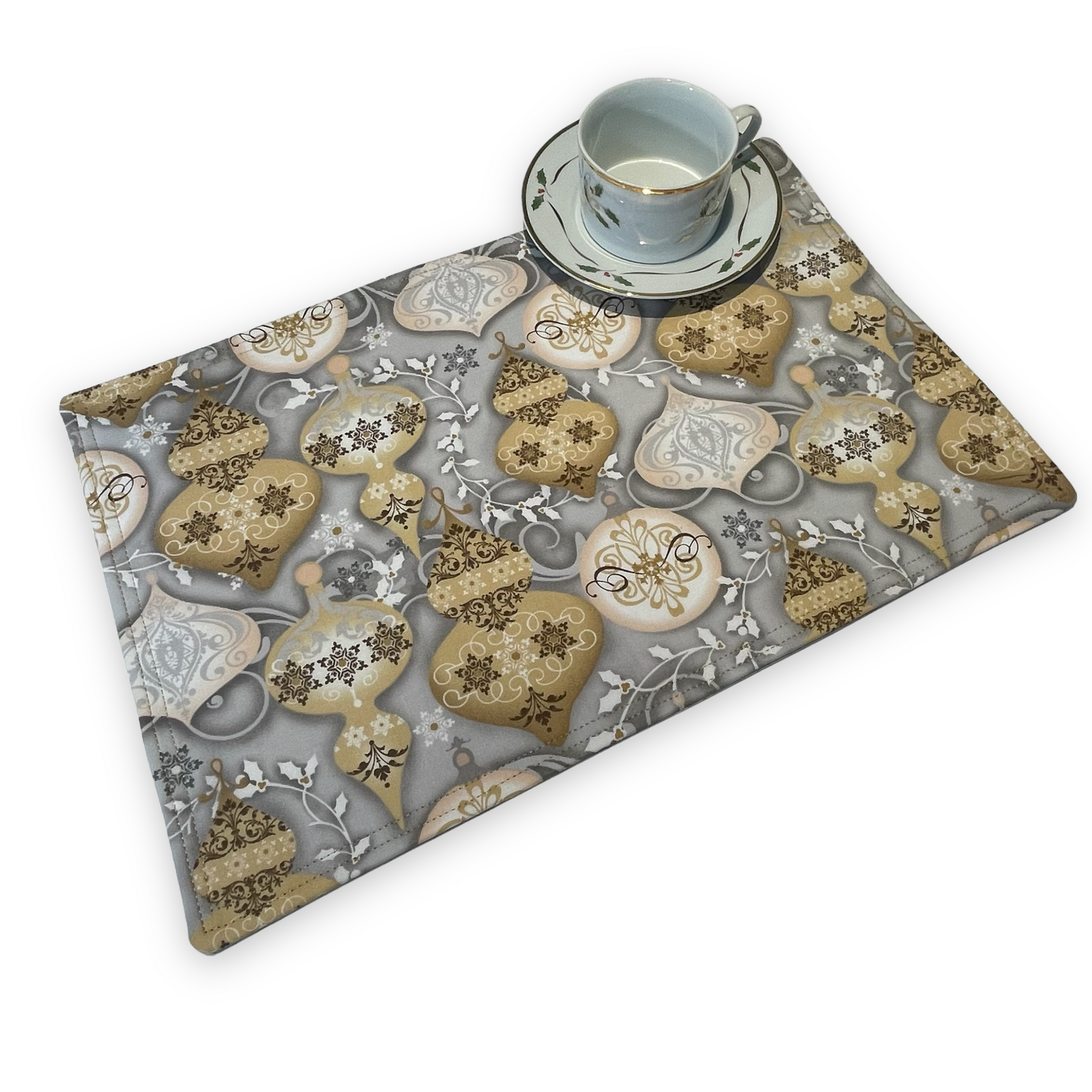 Set of two Christmas Placemats, handmade in Canada Featuring Gold and Cream Christmas Ornaments on one side and Silver Snowflakes on the reverse. Easily dress up your Christmas Kitchen Table with these stylish luxury placemats. Check out all the mix and match decor at Home Stitchery Decor