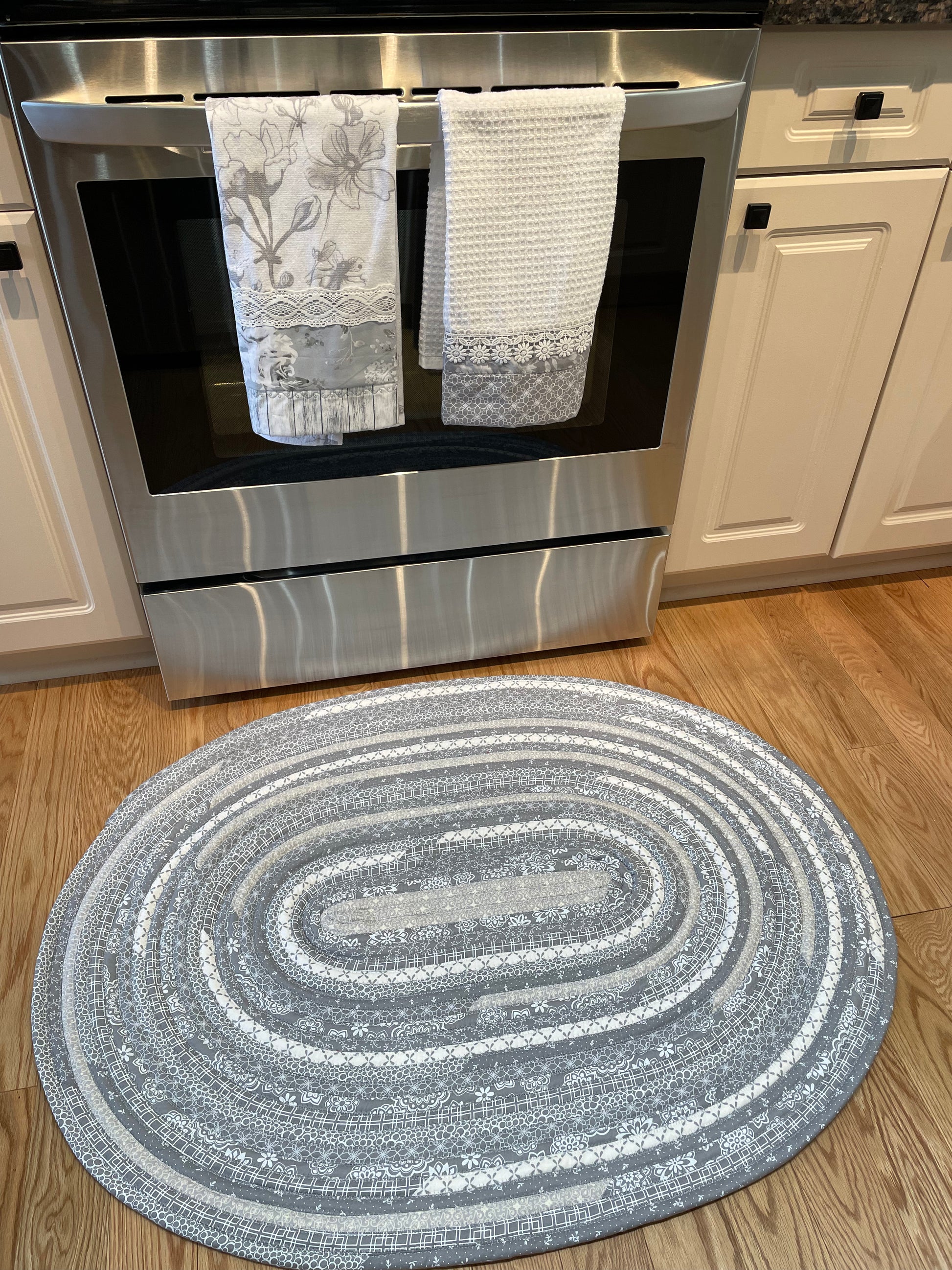 Grey and White Modern Farmhouse Kitchen Accent Rug. Can be used as a luxury bathmat, or bedside rug.  Washable, Cotton and made in Canada with globally sourced supplies.  Matching dish towels and shower curtains also available.  Check out the Home Stitchery Decor YouTube Channel. 
