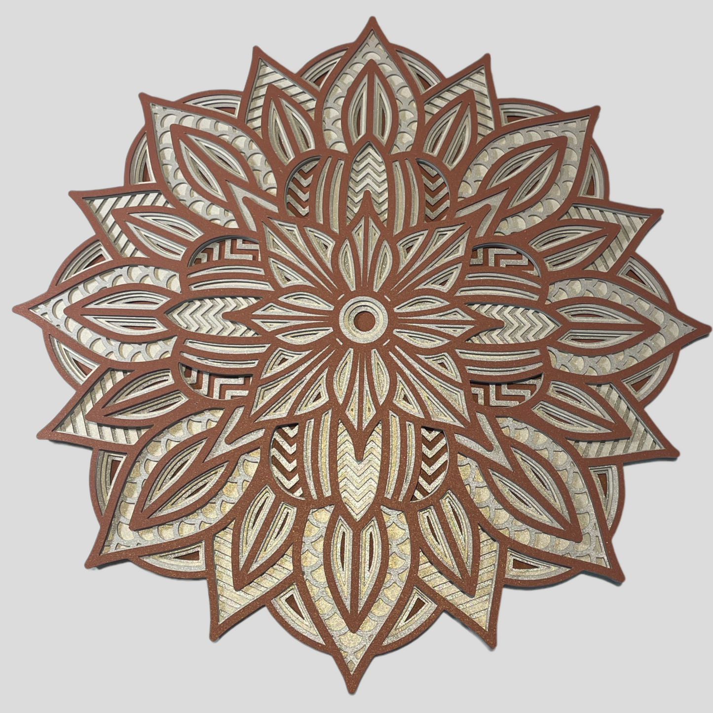 Image showing a 3d Layered Mandala Design which is an instant download SVG design by Home Stitchery Decor.  This 3d Layered Mandala can be cut out with Cricut, Silhouette, CNC or laser machines.  Create your own one-of-a-kind 3d Layered Mandala by following along with the complete tutorial on the Home Stitchery Decor YouTube Channel