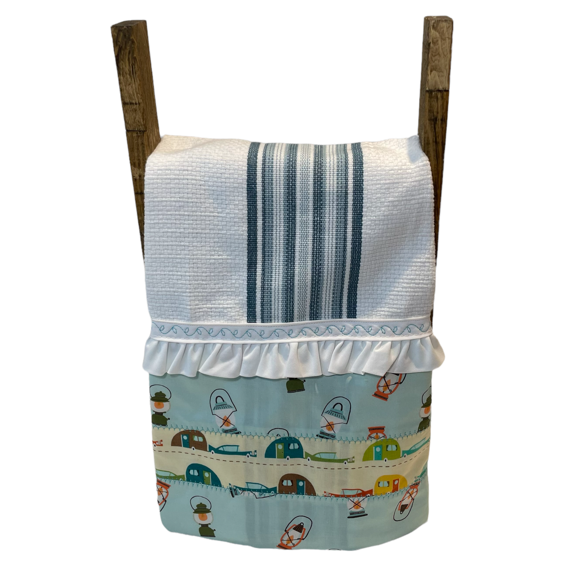 Decorative Kitchen Tea Towel on a Kitchen Counter Dish Towel Ladder. White and green striped toweling with cute retro boler trailers and camping lantern accents. Also features ruffled trim and embroidery stitching. This cute camping themed kitchen towel would make a lovely Mother's Day Gift. Part of a collection of coordinated kitchen linens. Shop the entire catalogue, or find out which local Farmers Market I pop up at. 