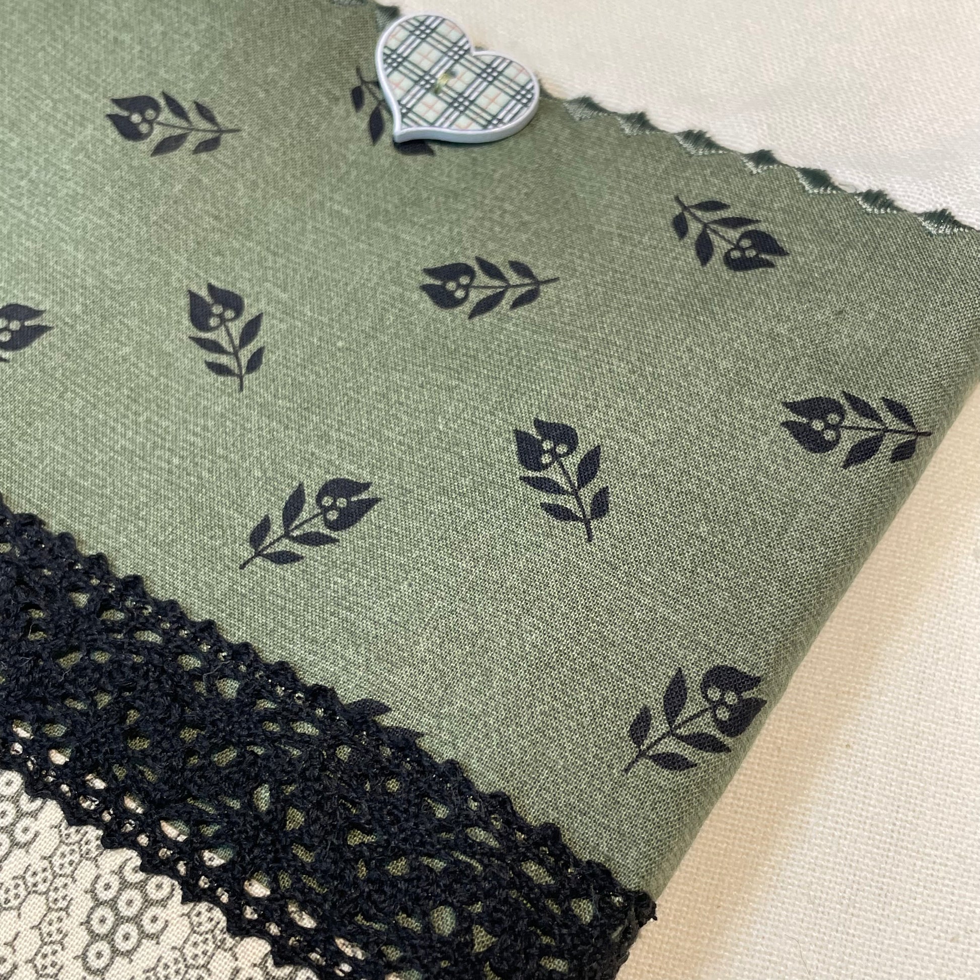 Vintage styled farmhouse dish towel. Cream cotton towel with green quilting cotton accents. Featuring black cotton lace trim, a gingham button and embroidery stitching. Part of a mix and match collection, browse your favorites! Then check out the Home Stitchery Decor YouTube Channel for more fabulous Farmhouse Fun DIY
