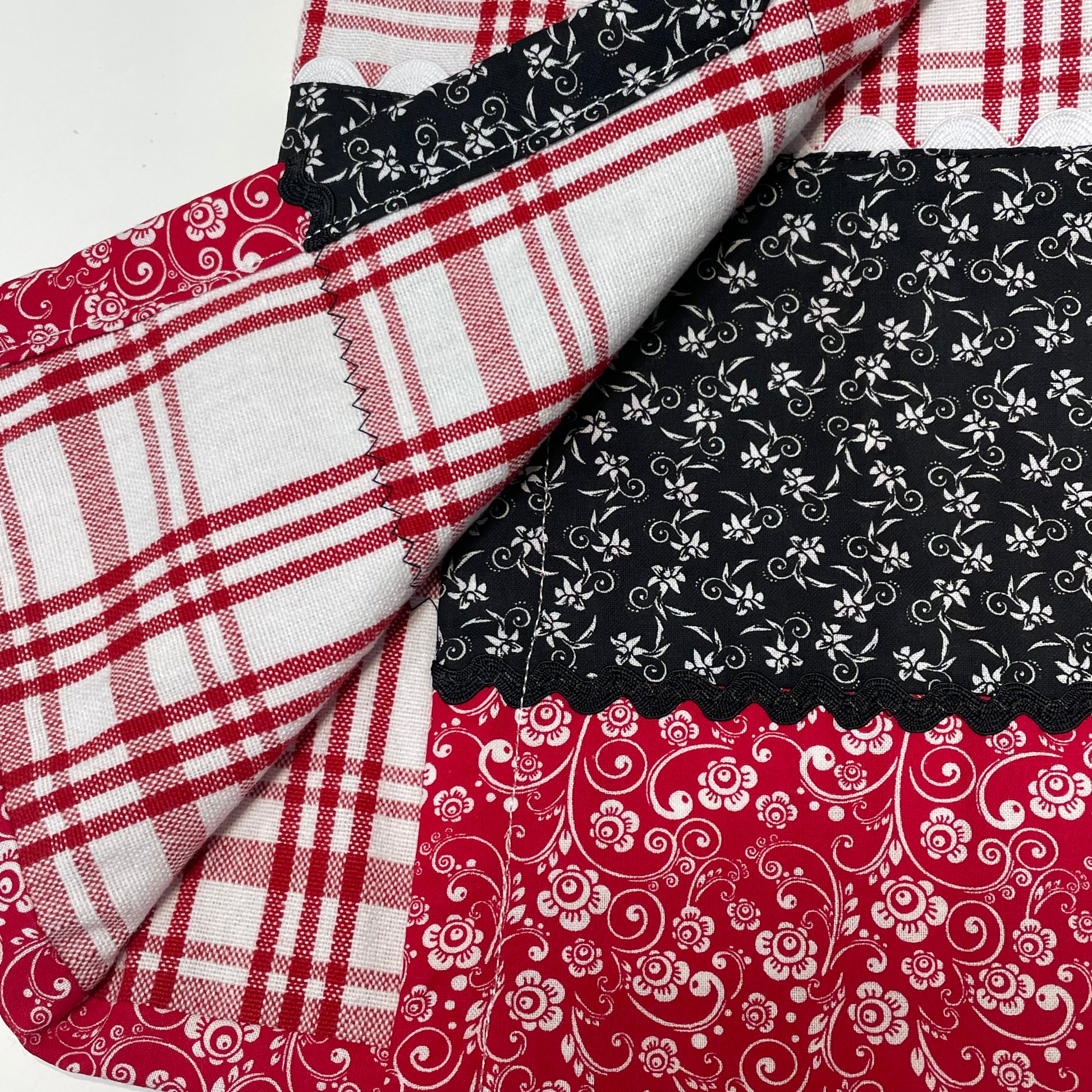Country Style Dish Towel in Red and White check toweling with black and red quilting cotton. Featuring Black Ric Rac and button embellishments. Part of a mix and match line of farmhouse fabulous decor. Browse the entire collection. Then check out the Home Stitchery Decor YouTube Channel
