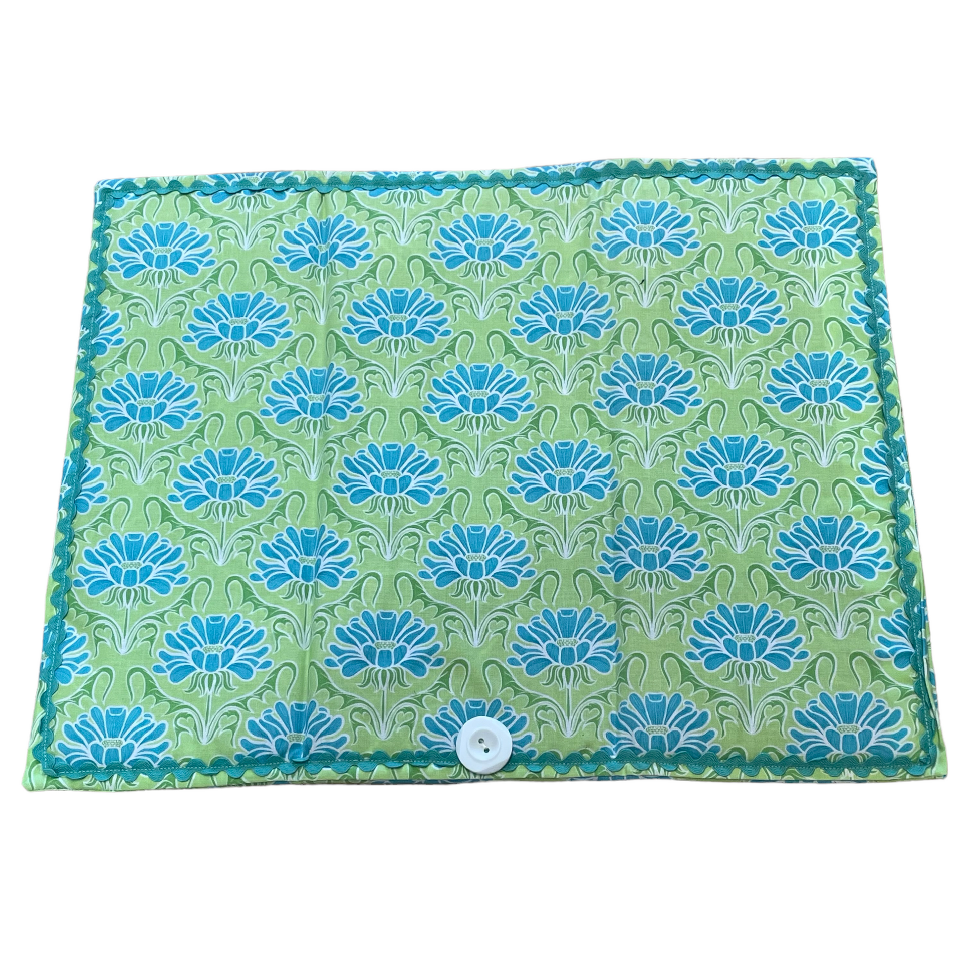 Teal and Green handcrafted dish drying mat. Featuring teal flowers, ric rac and a white button. Part of a coordinated collection of kitchen linens. Shop the collection, or follow along on with sewing and 3d Layered Mandala tutorials on the Home Stitchery Decor YouTube Channel