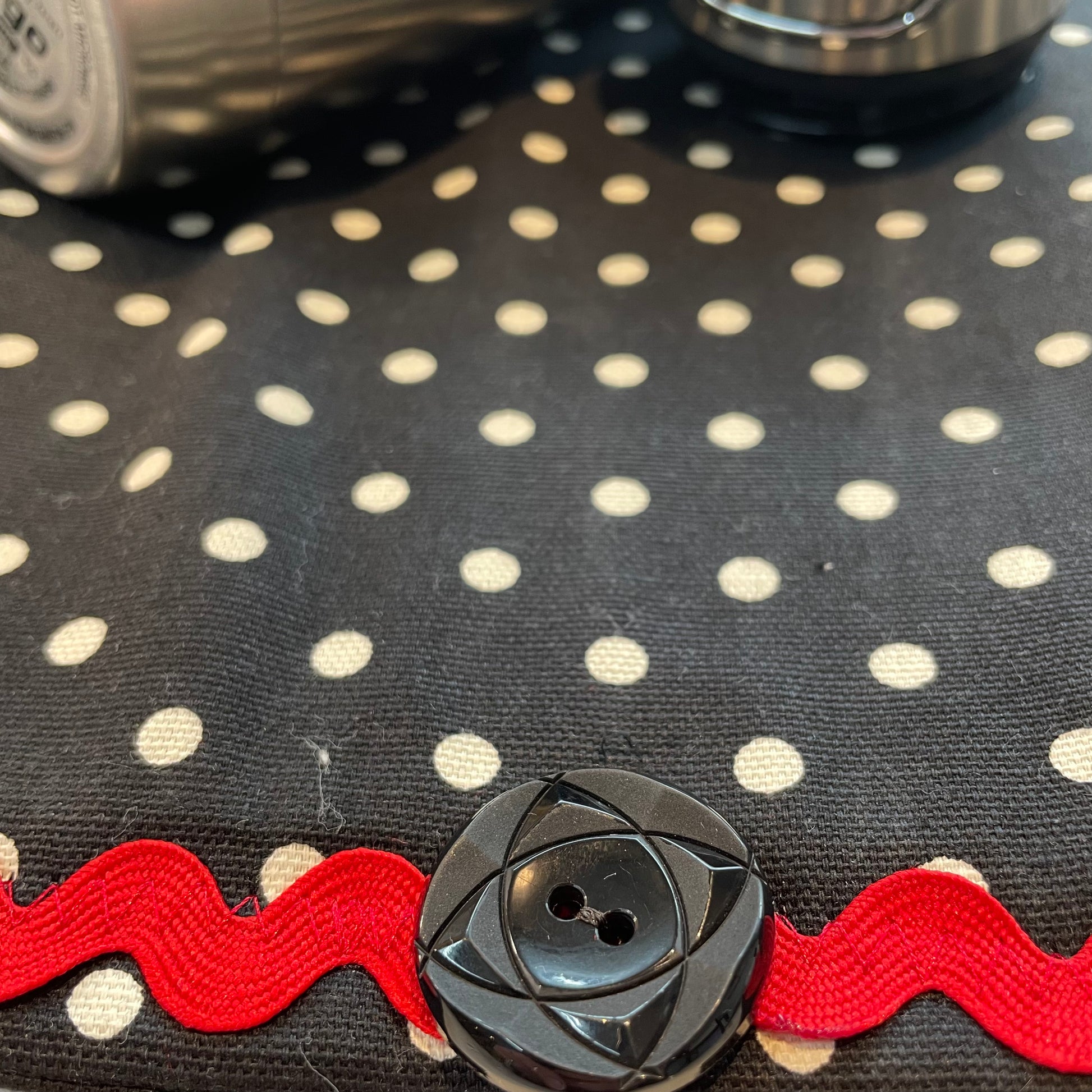 Retro Black and White Polka Dot Dish Drying Mat with Red and white trim and a black accent button. Vintage style kitchen decor for 21st century. Part of a mix and match collection so be sure to check out all the coordinating products. Handcrafted in Canada. Find out more on the Home Stitchery Decor YouTube Channel