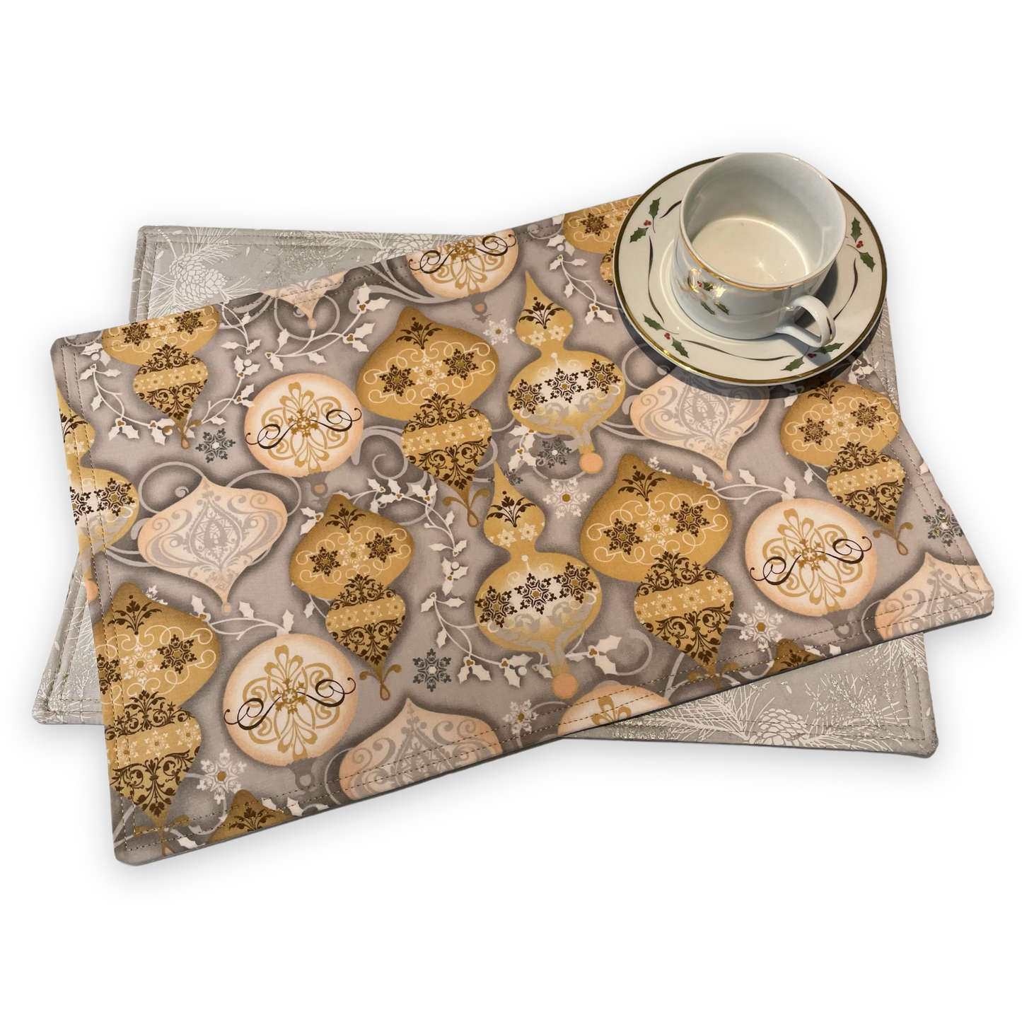 Reversible Christmas Placemats Featuring Gold and Silver Ornaments on one side and Silver Pinecones on the opposite side. Luxurious handmade Christmas Table Placemats. Part of a collection by Home Stitchery Decor.  Check out all the mix and match items online.