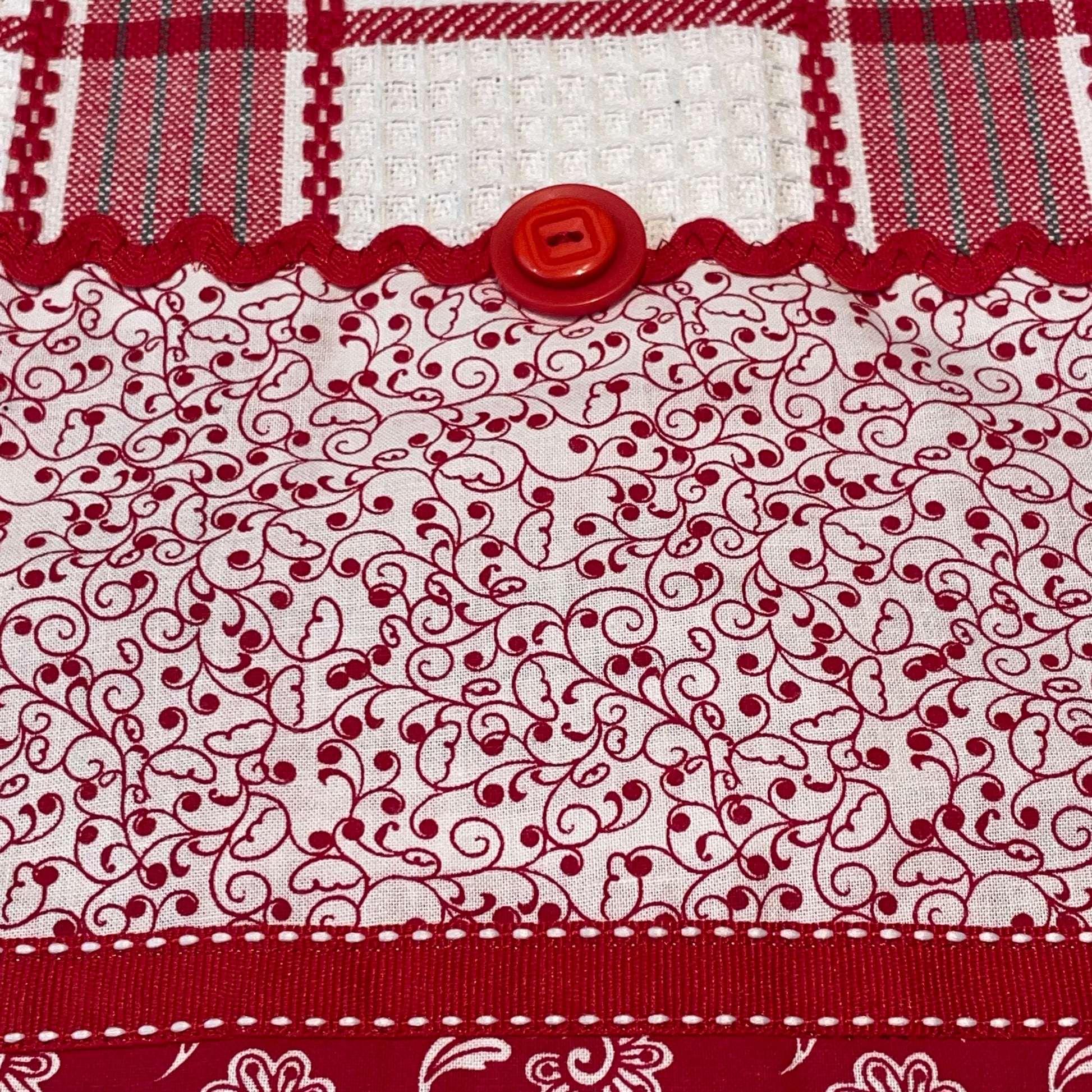 Red and White Kitchen Dish Towel with quilting cotton accents. Featuring Embroidery, Ric Rac and and Button Details. Part of a mix and match collection. Browse the entire line of coordinated products exclusive to Home Stitchery Decor. And be sure to watch the Home Stitchery Decor YouTube Channel.