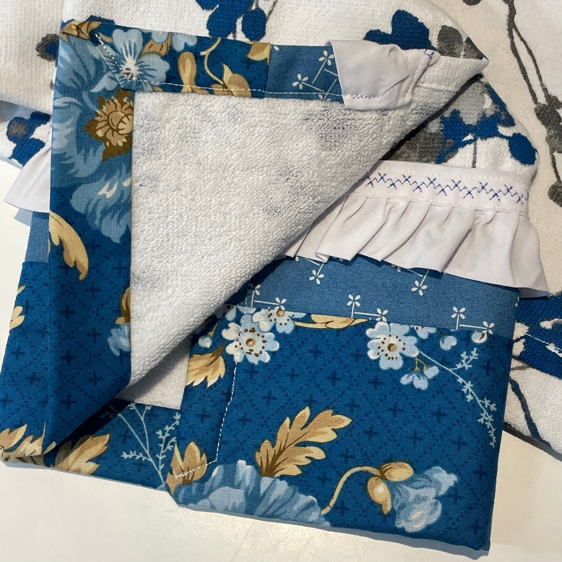 Blue and White Handmade Modern Farmhouse Tea Towel. Part of a mix and match collection of coordinating farmhouse home decor. Check it out at Home Stitchery Decor and be sure to check out the Home Stitchery Decor YouTube Channel