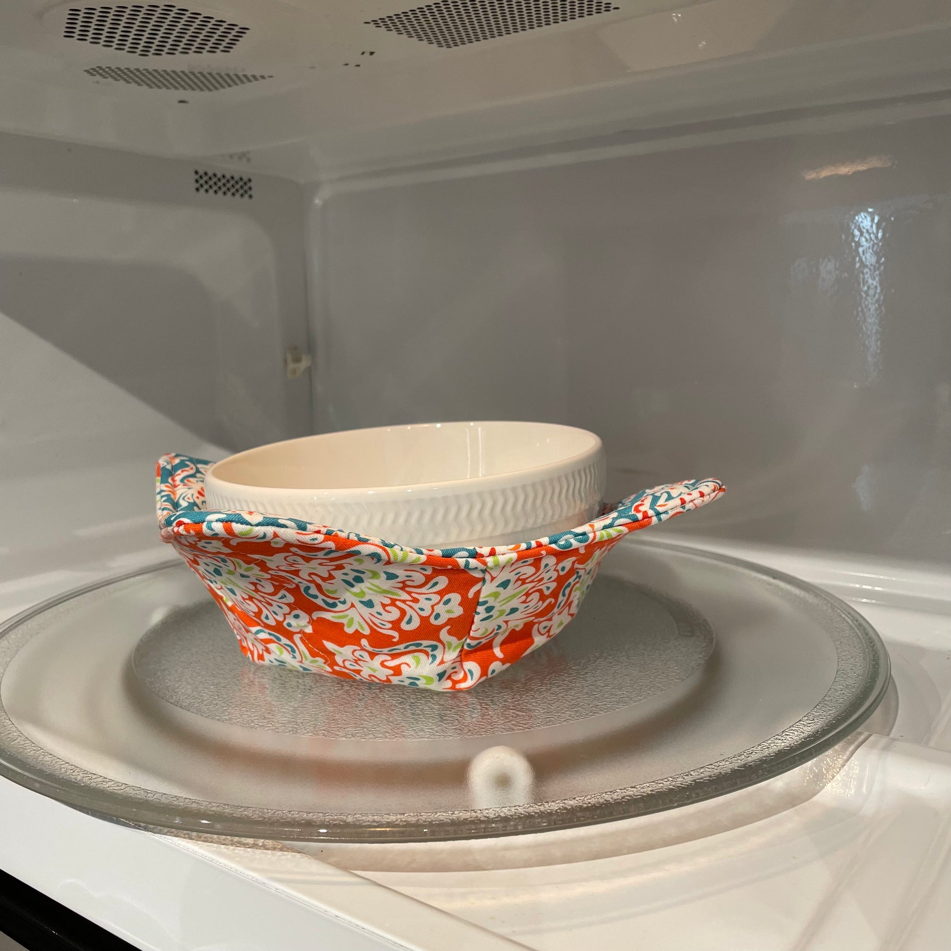 Sewing kit for beginners. Learn to sew a Microwave Soup Bowl Cozy. Featuring orange and teal fabric, cotton thread and Pellon Wrap and Zap batting. Purchase a sewing kit or the finished item from my website. Follow along with complete farmhouse fabulous tutorials on the Home Stitchery Decor YouTube Channel.