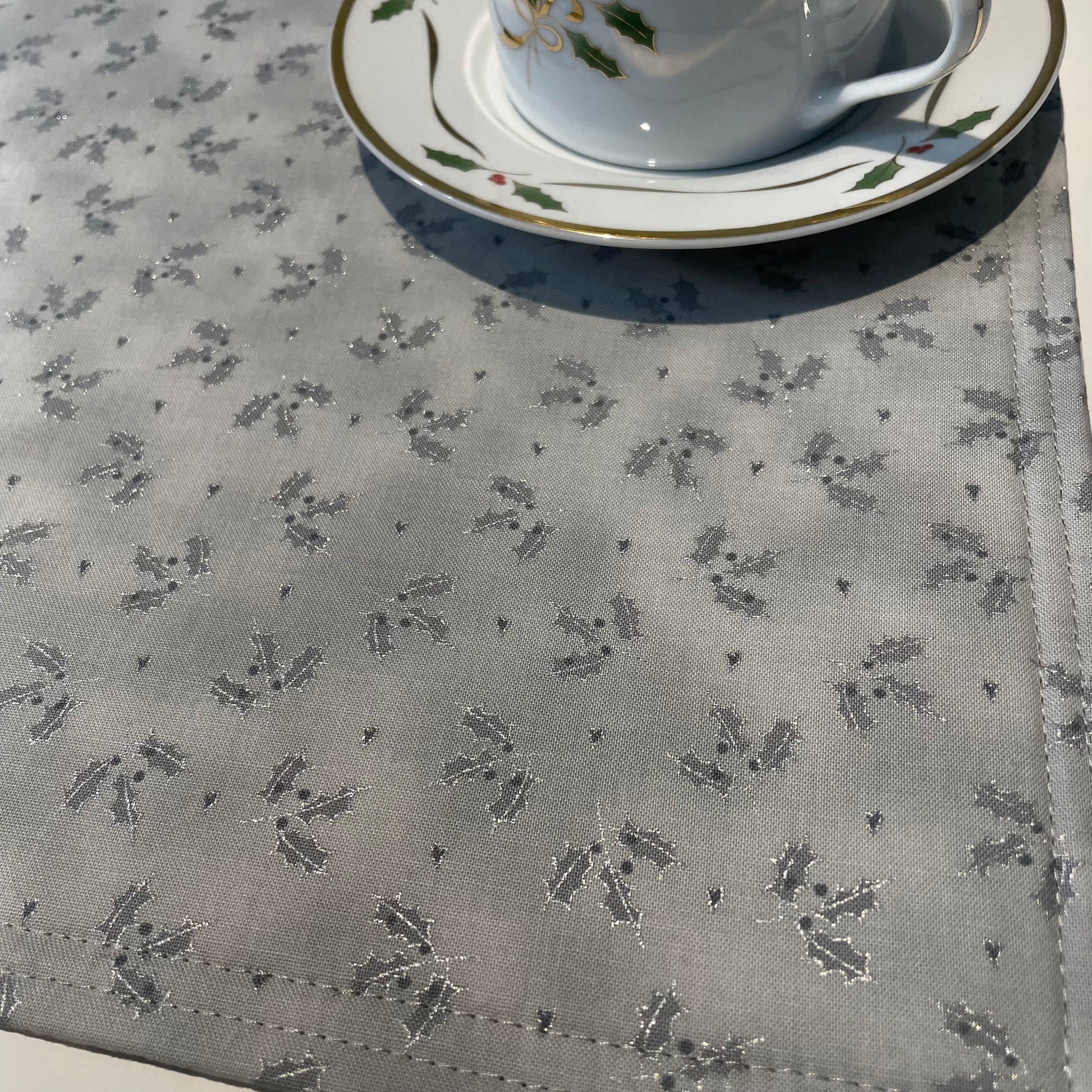 Set of two Christmas Placemats, handmade in Canada Featuring Gold and Cream Christmas Ornaments on one side and Silver Snowflakes on the reverse. Easily dress up your Christmas Kitchen Table with these stylish luxury placemats. Check out all the mix and match decor at Home Stitchery Decor