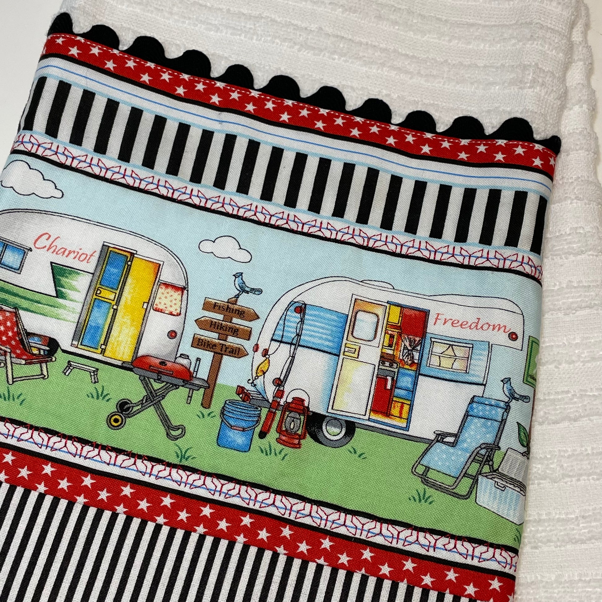 Glamping decor so cute you will want to live in your RV. White tea towel with retro campers in red, white, black and blue. Embroidery and ric rac detailing. Part of a collection of coordinated camping decor. Shop the mix and match collection and be sure to watch the Home Stitchery Decor YouTube Channel for tutorails!