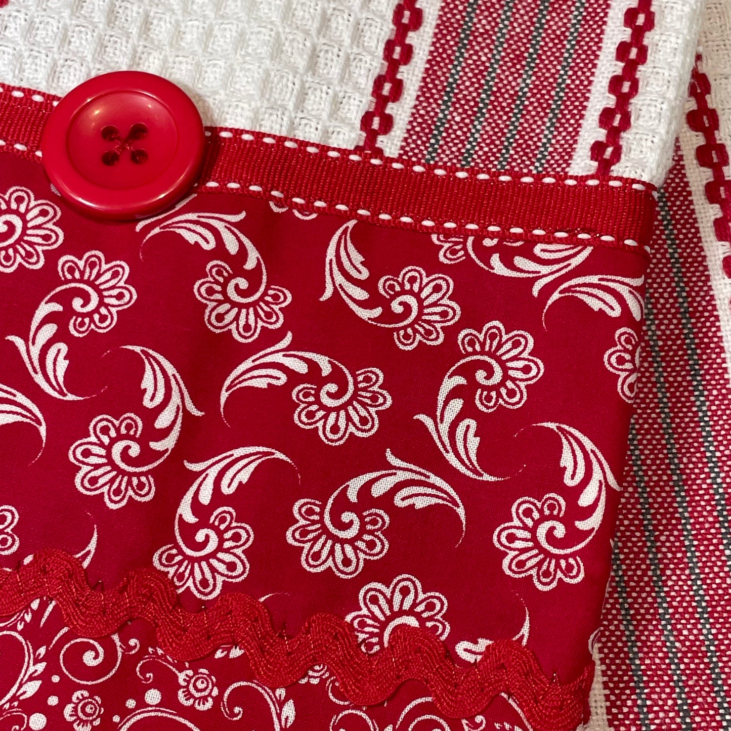 Country Style Red and White Dish Towel. Red and white toweling with quilt cotton, ribbon and button embellishments. Part of a mix and match collection. Browse all the products and follow along on the Home Stitchery Decor YouTube Channel.