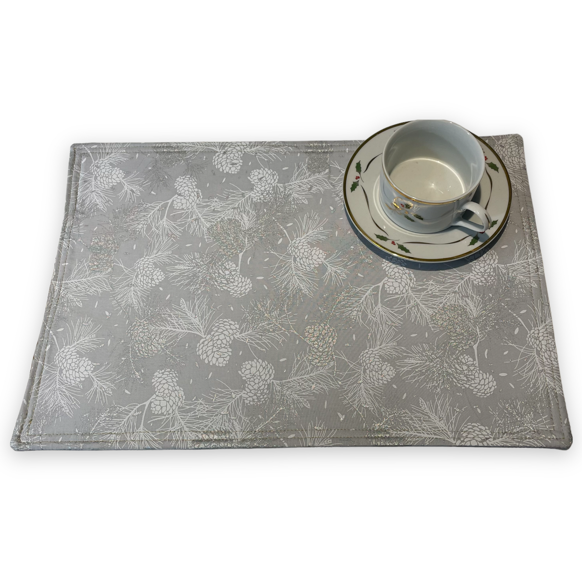 Reversible Christmas Placemats Featuring Gold and Silver Ornaments on one side and Silver Pinecones on the opposite side. Luxurious handmade Christmas Table Placemats. Part of a collection by Home Stitchery Decor. Check out all the mix and match items online.
