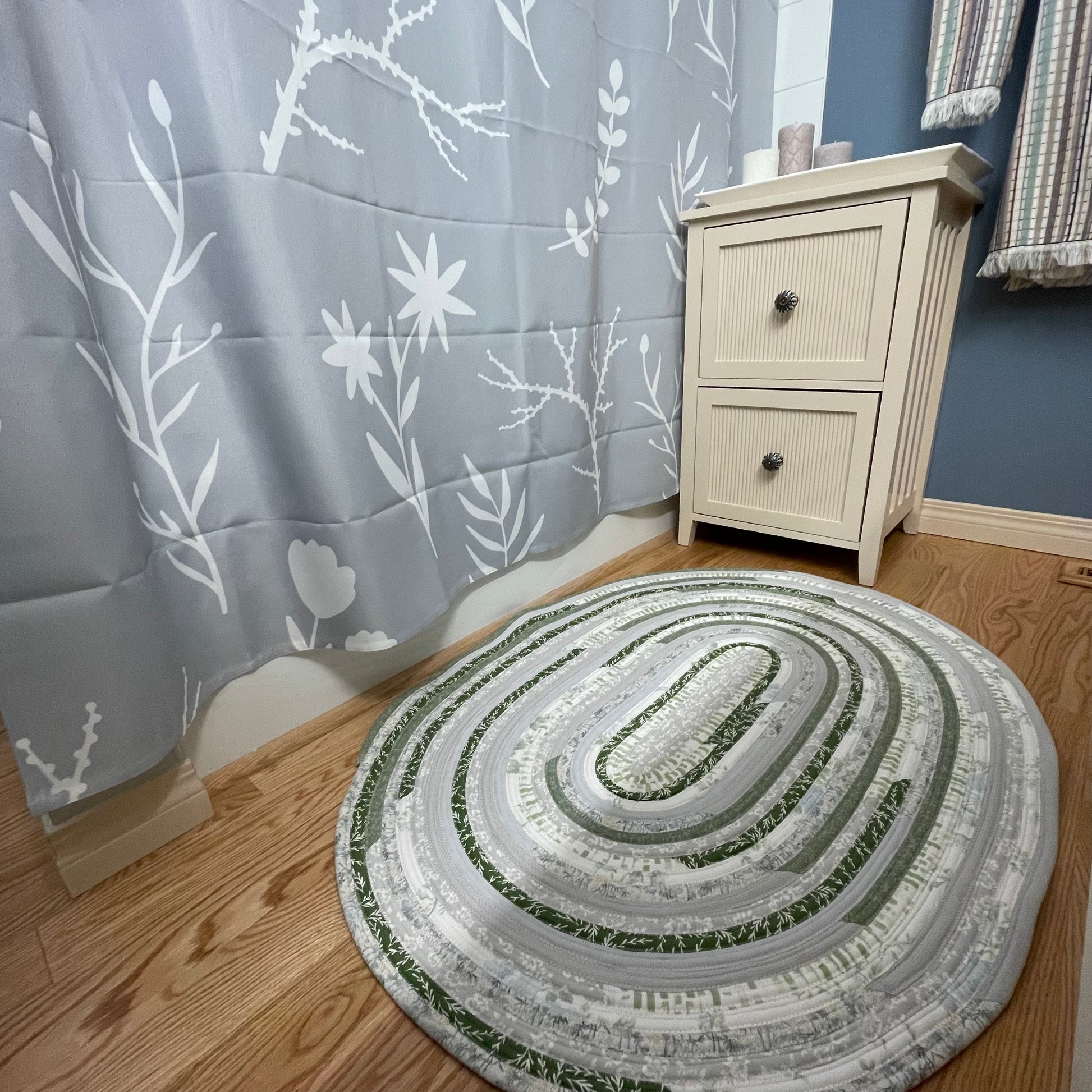 Green and grey cotton kitchen, bedside or bathmat accent rug.  Washable and handcrafted exclusively by Home Stitchery Decor.  Part of a mix and match collection. Features high quality quilting cotton exterior and Pellon Batting fill.  One of a kind.